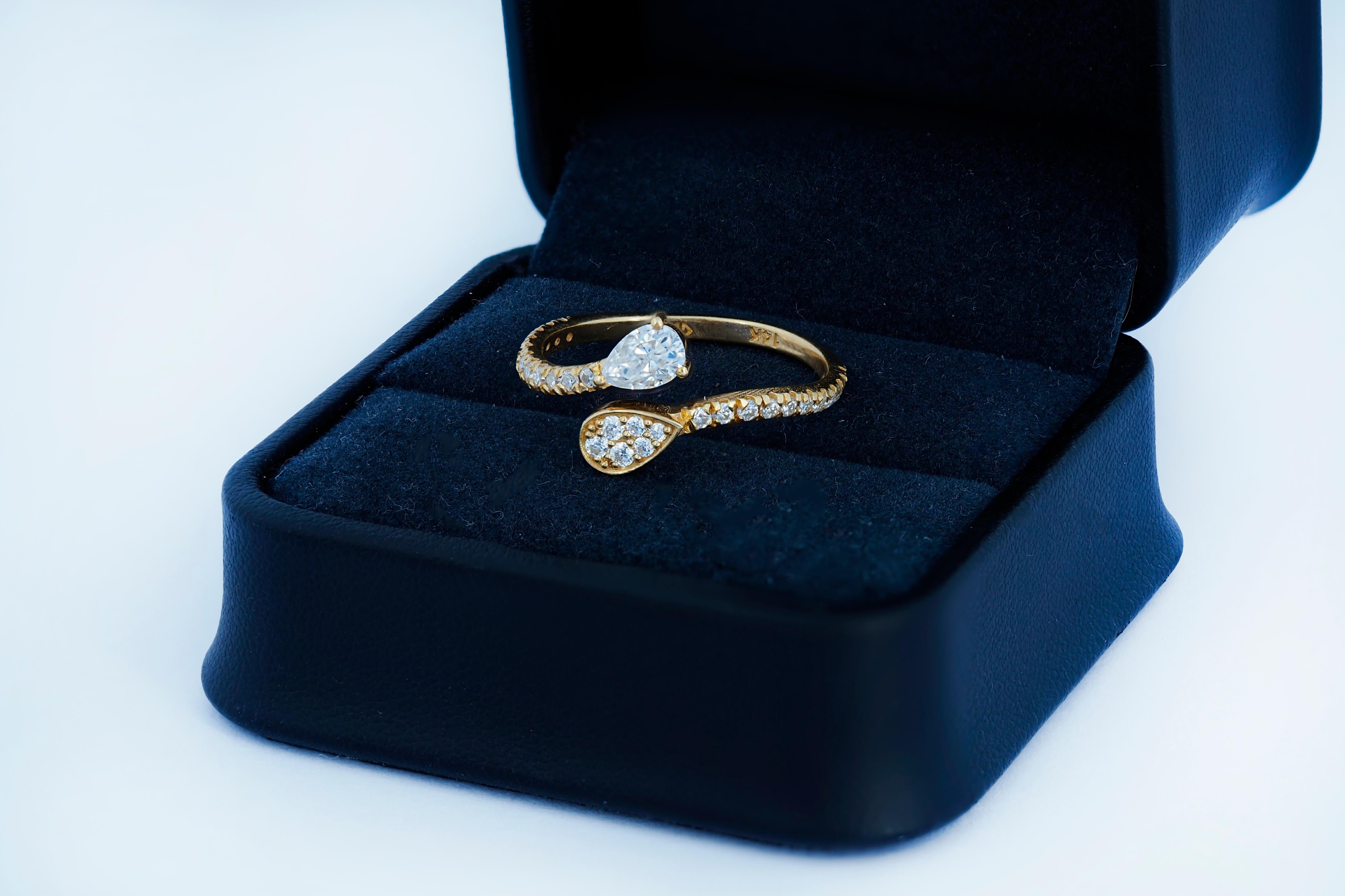 For Sale:  Pear and round diamond cut moissanite open ended 14k gold ring.  6