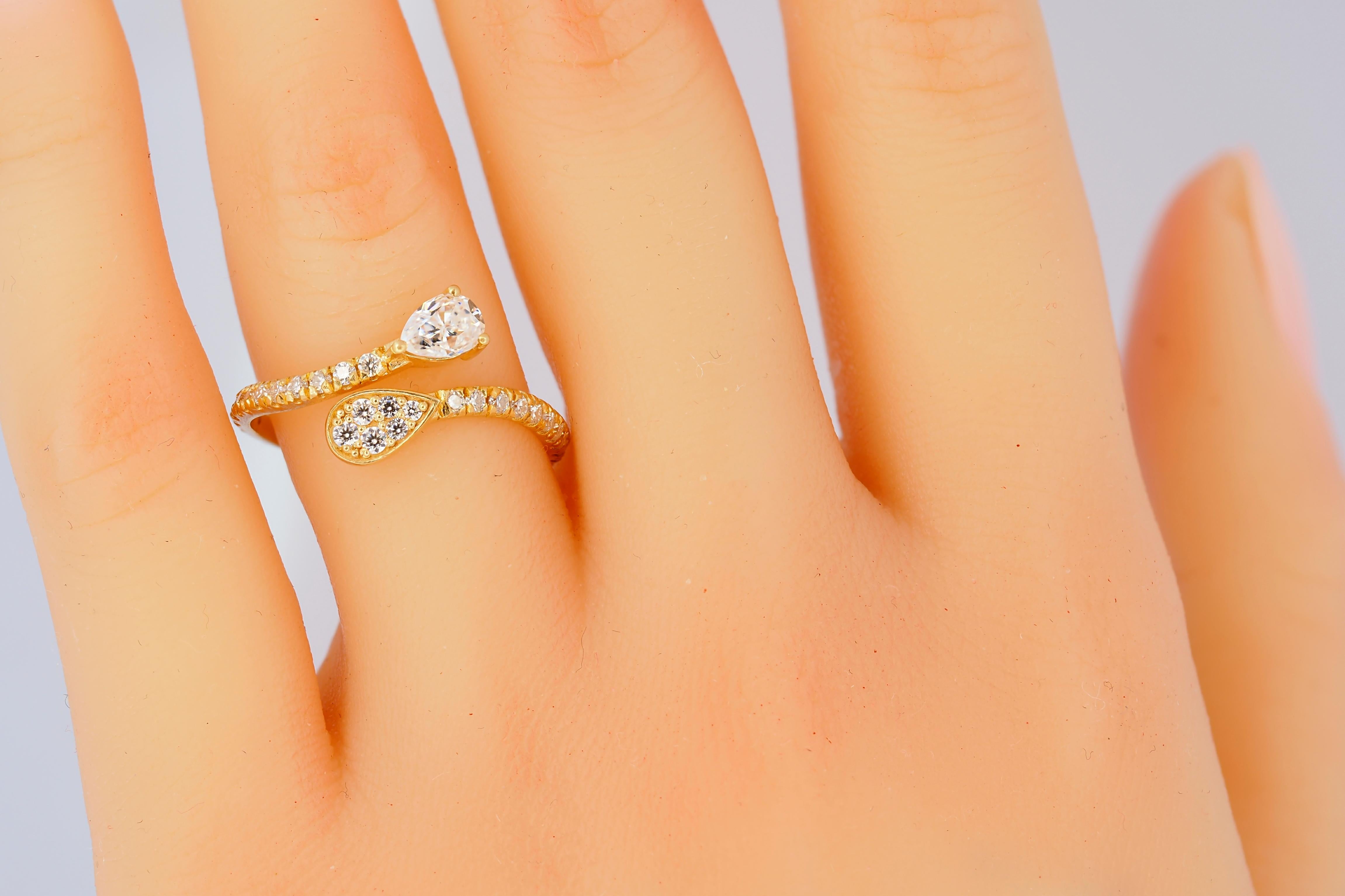 For Sale:  Pear and round diamond cut moissanite open ended 14k gold ring.  7