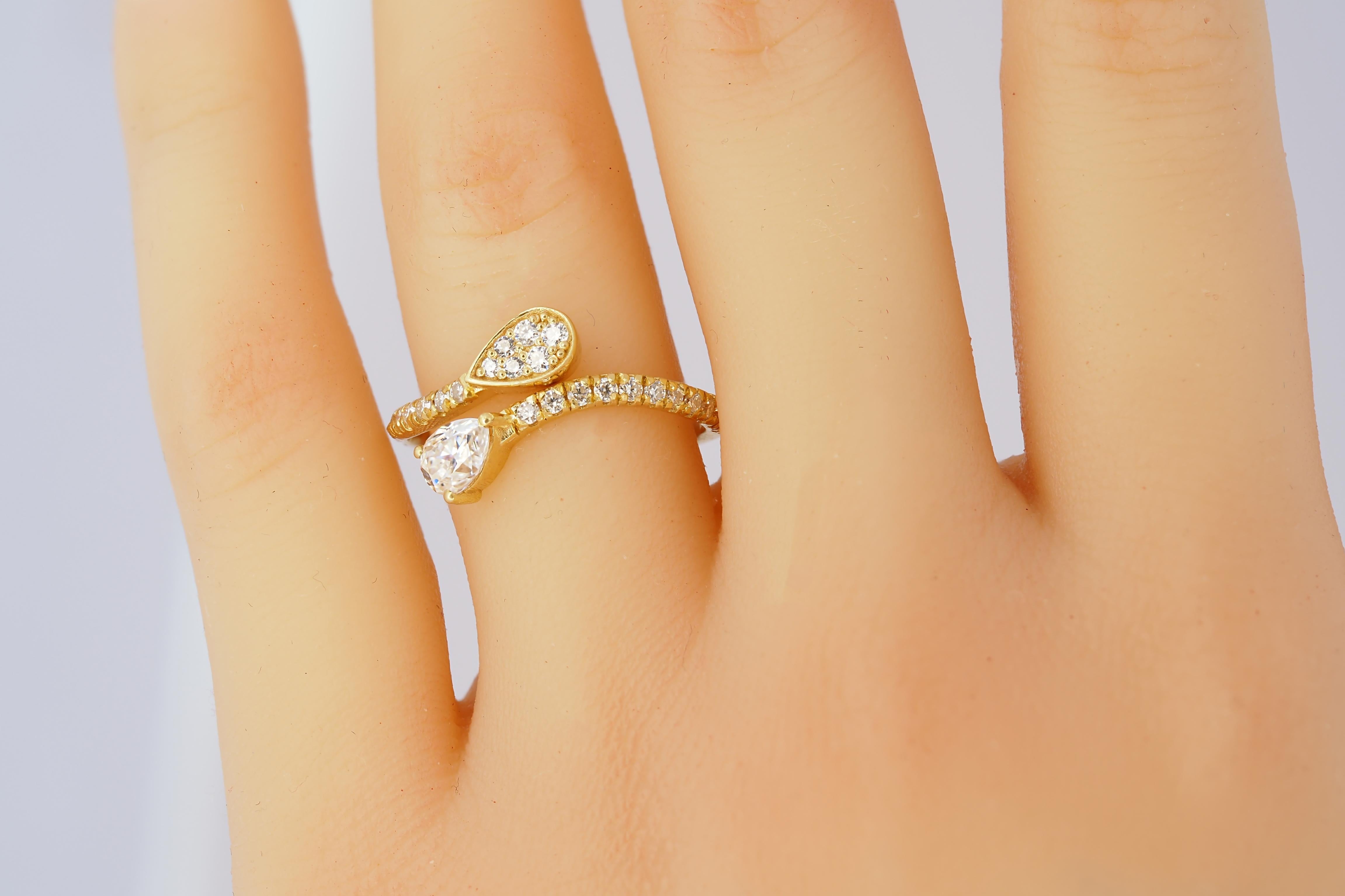 For Sale:  Pear and round diamond cut moissanite open ended 14k gold ring 7