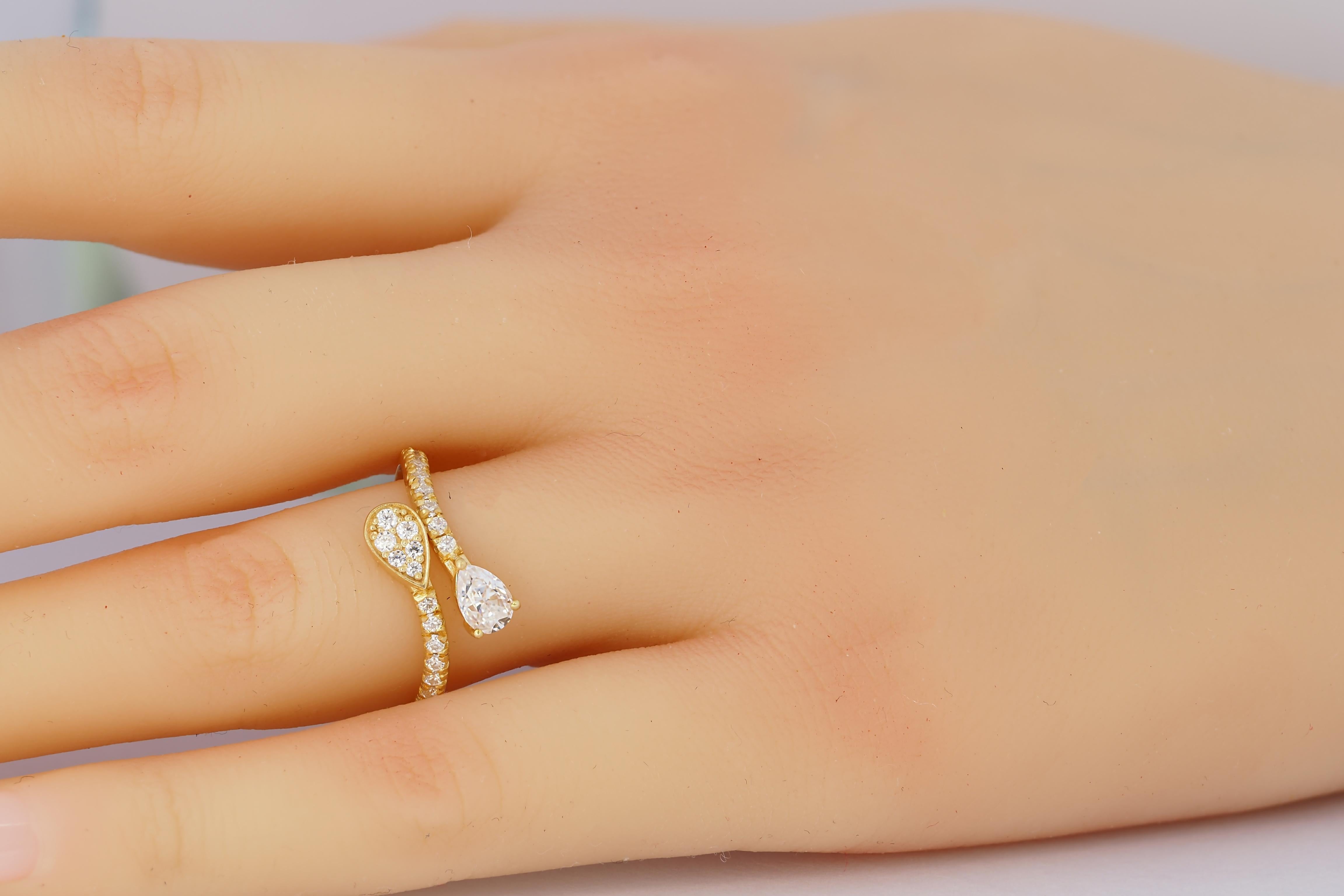 For Sale:  Pear and round diamond cut moissanite open ended 14k gold ring 8