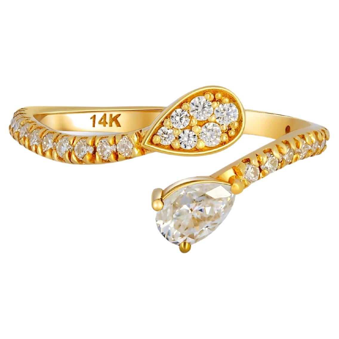 For Sale:  Pear and round diamond cut moissanite open ended 14k gold ring.