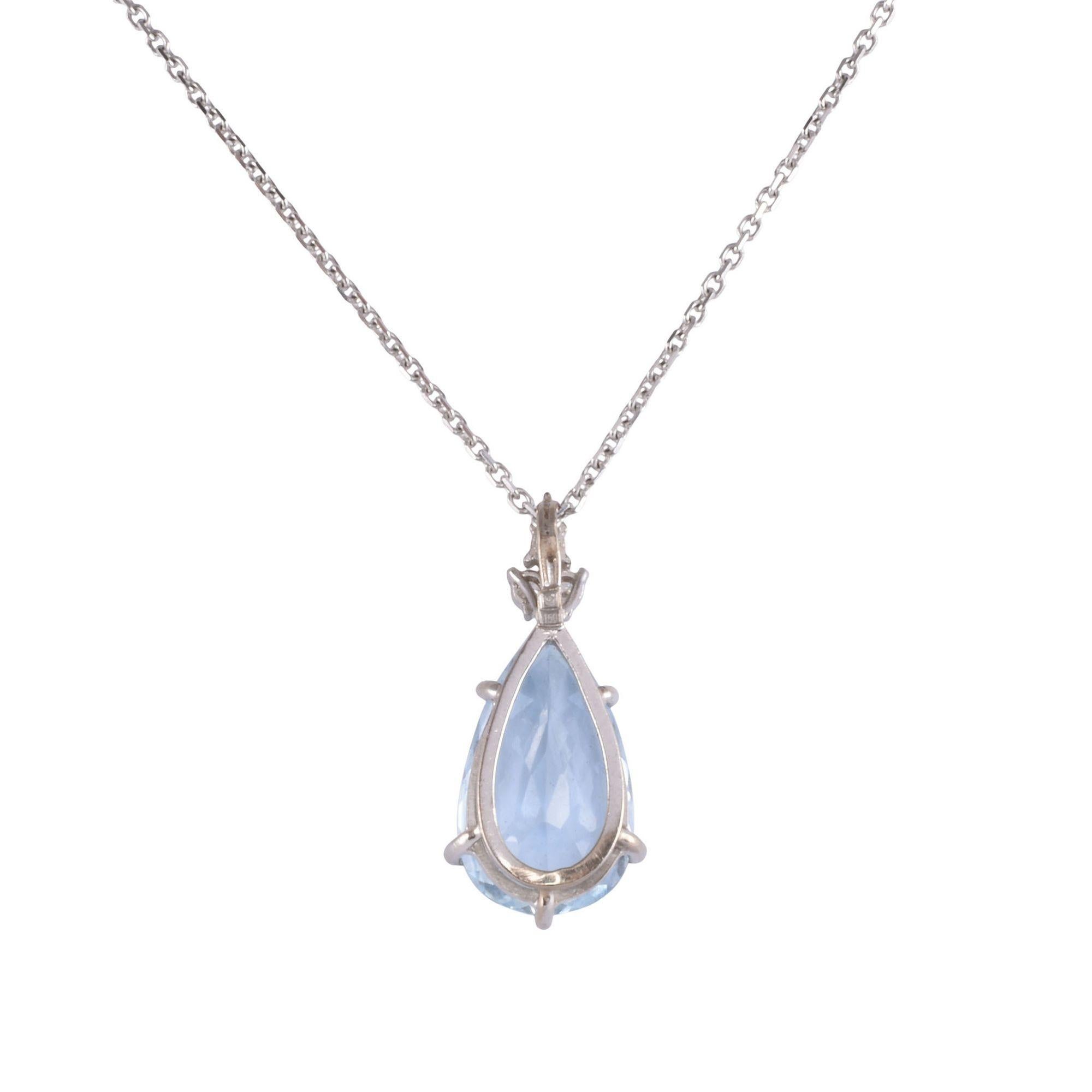 Estate pear aquamarine white gold pendant necklace. This 14 karat white gold pendant features a pear aquamarine at 7.75 carats. The aquamarine is clean and nicely cut. There are three accent diamonds at .11 carat total weight. The diamonds have VS