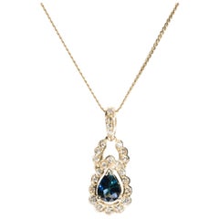Pear Blue Sapphire and Diamond Pendant with 14 Carat Yellow Gold Chain