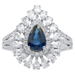 Bague de fiançailles pour elle : saphir bleu poire, diamant, double halo.