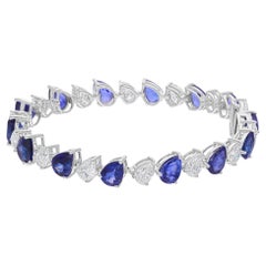 Bracelet en or blanc 18 carats avec saphir bleu poire et diamants SI/H