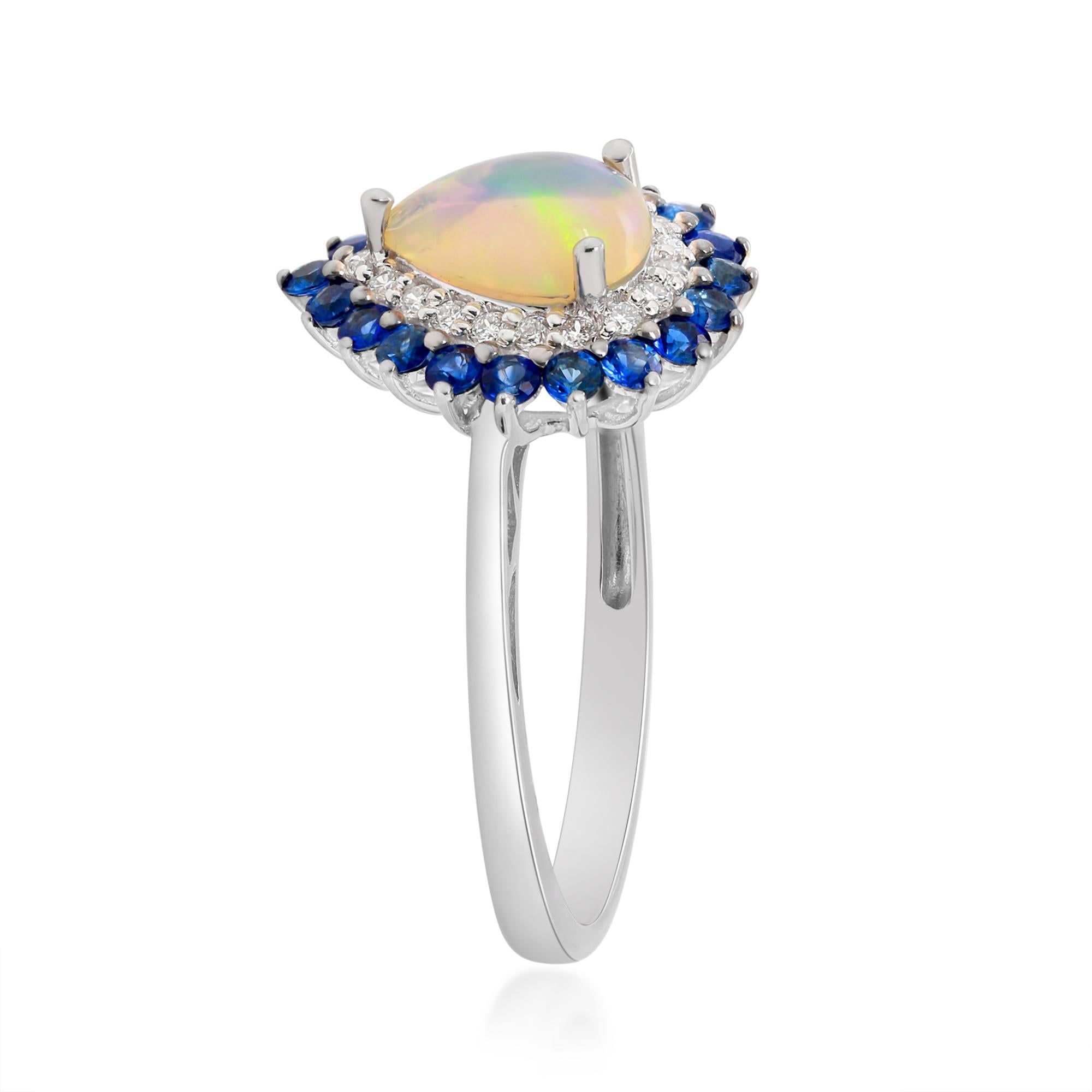 Decorate yourself in elegance with this Ring is crafted from 10-karat White Gold by Gin & Grace. This Ring is made up of 6x8 mm Pear-Cab (1 pcs) 0.65 carat Ethiopian Opal, Round-cut Blue Sapphire (19 pcs) 0.46 carat and Round-cut White Diamond (19