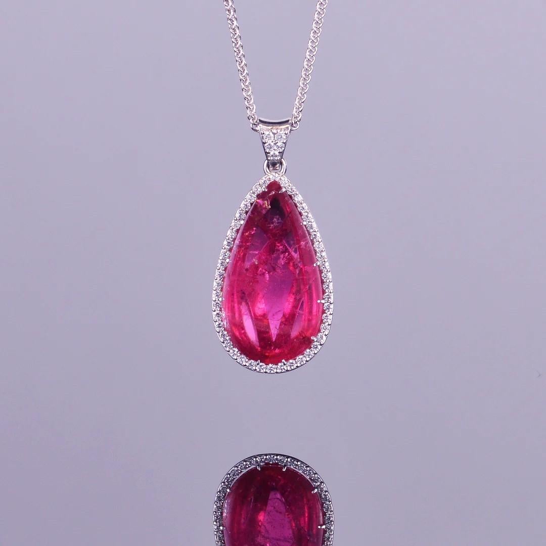 A remarkable 8.88 carat pear shaped rubellite, surrounded by a gorgeous white diamond halo. All tastefully set in 14k white gold. The pendant comes with an 18 inch adjustable chain, and the dimensions of the pendant are 27mm x13mm.
