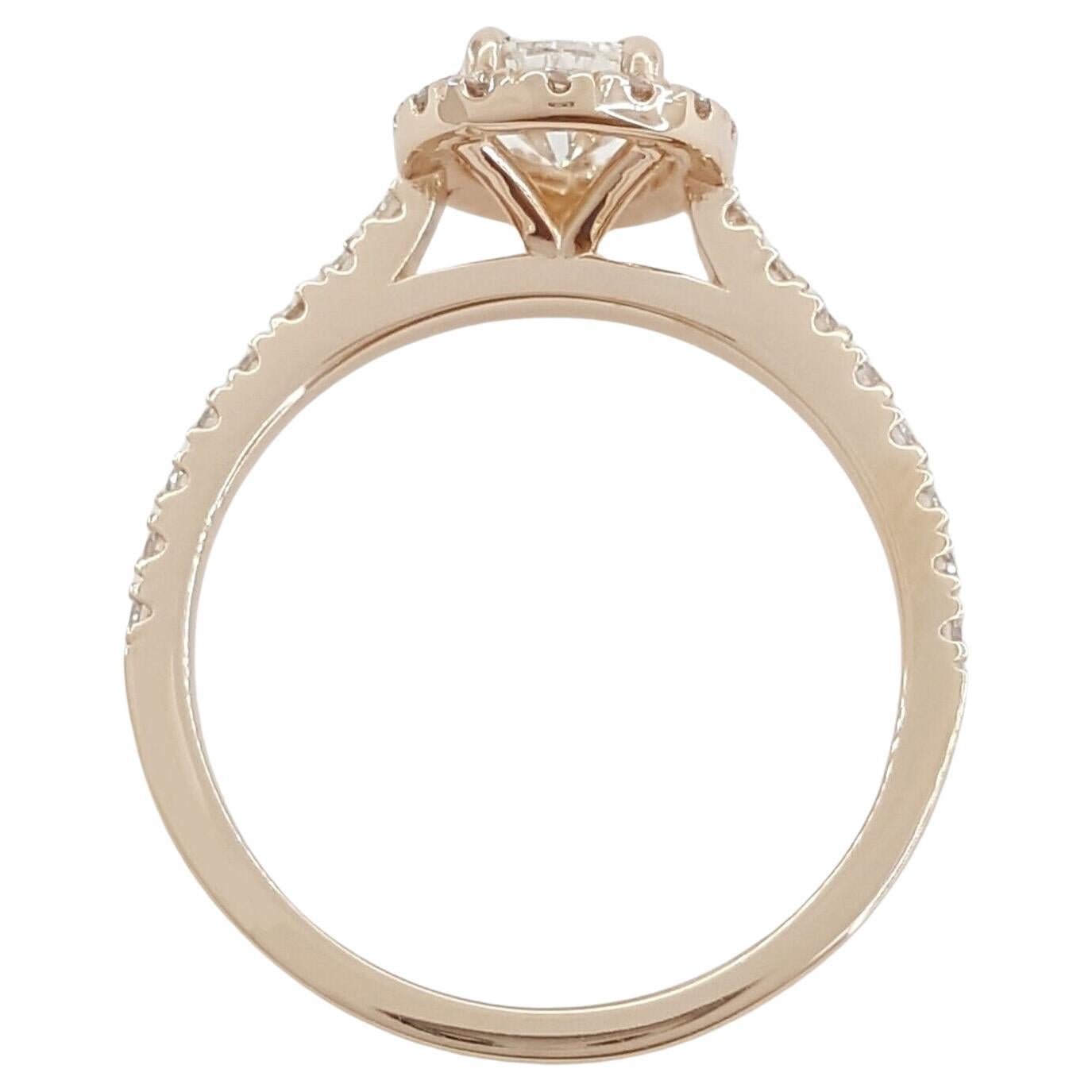 Presenting an exquisite 1.4-carat total weight Pear Brilliant Cut Diamond Halo Engagement Ring in elegant 14k Rose Gold.

This beautifully crafted ring has a total weight of 2.8 grams and is designed in a size 6. The centerpiece of this ring is a