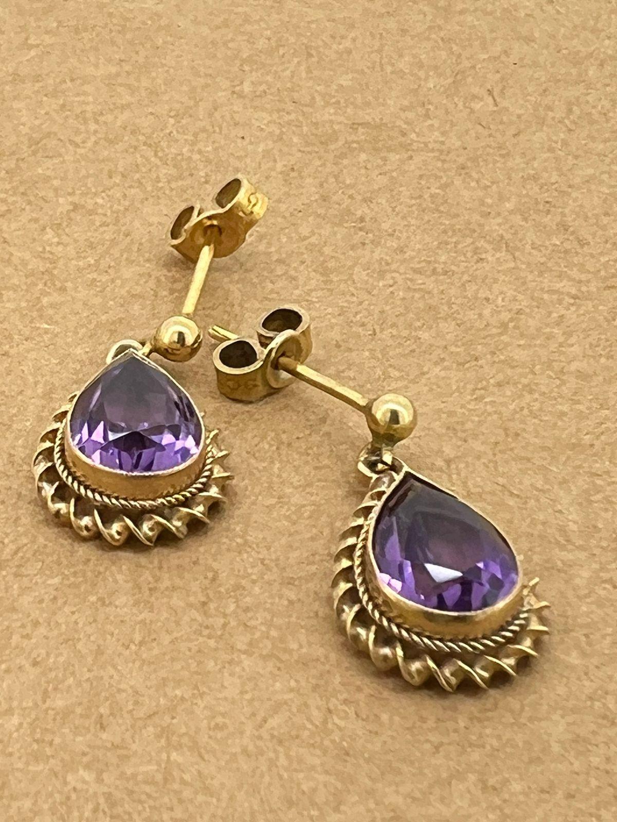 Women's Pear Cut Amethyst Earrings in 9K Yellow Gold. English Hallmarks: London, c1965. For Sale