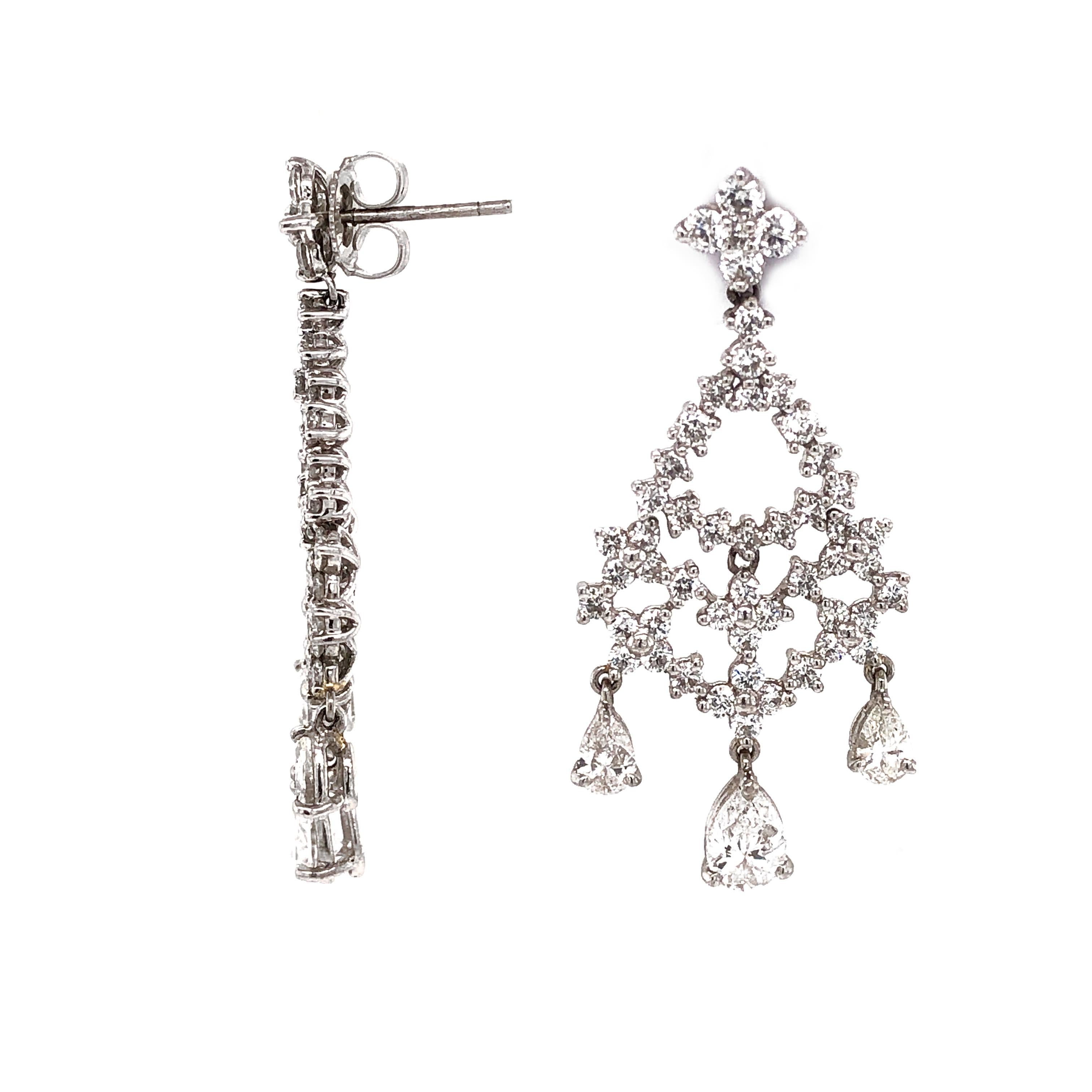 Elegant drop and chandelier mix diamond platinum earrings.
High-light diamond stones in pear cut and accented with smaller round diamonds. 
All diamonds in total are 5.32 carat. 
Diamonds are white and natural and in G-H Color Clarity VS.
Platinum