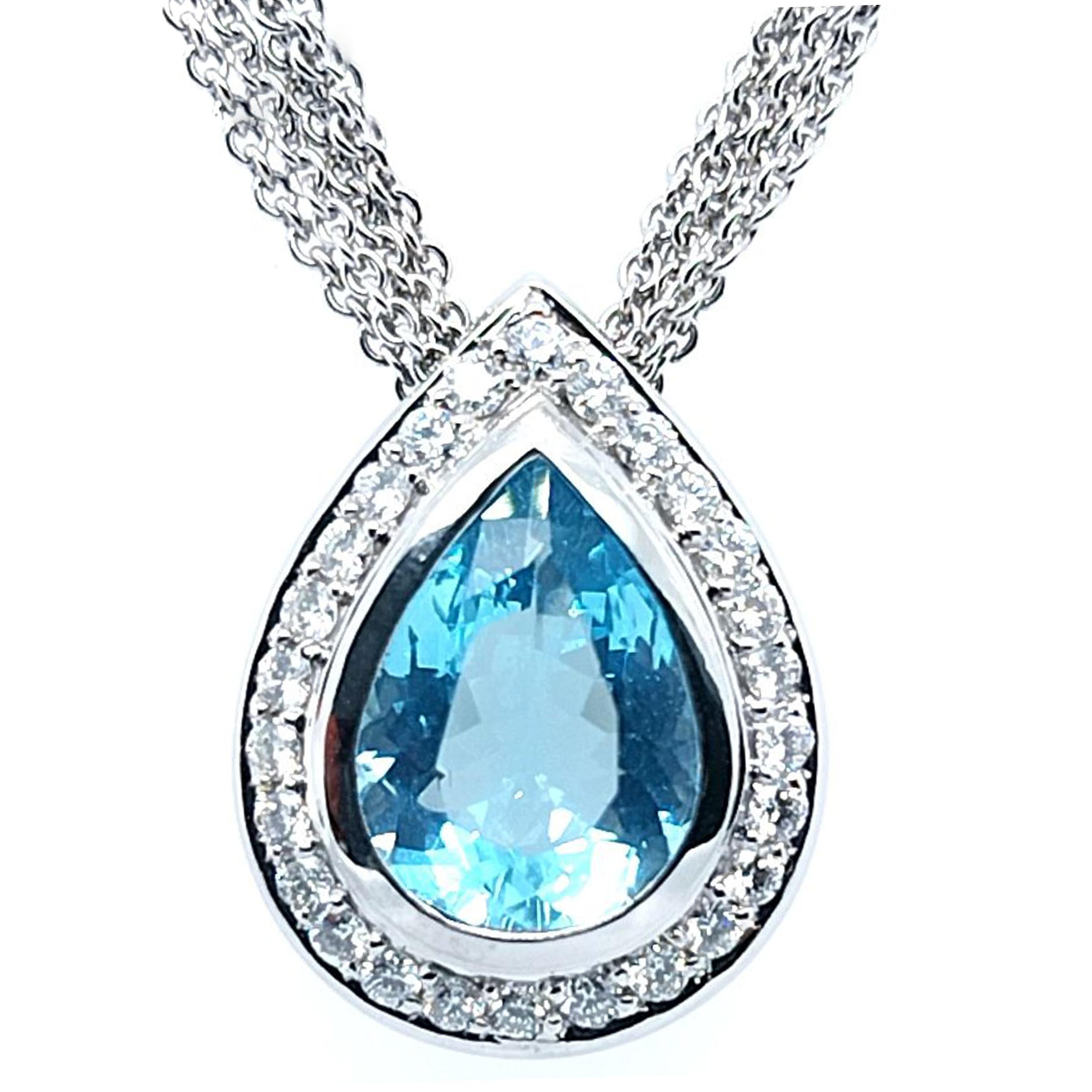 H&H Jewels 18 Karat White Gold Pendant Necklace Featuring A Bezel-set Pear Cut Aquamarine Estimated to Weight 3.00 Carats Surrounded by 26 Channel-set Round Brilliant Cut Diamonds of VS Clarity and G Color Totaling 0.52 Carats. Multi-strand Rolo