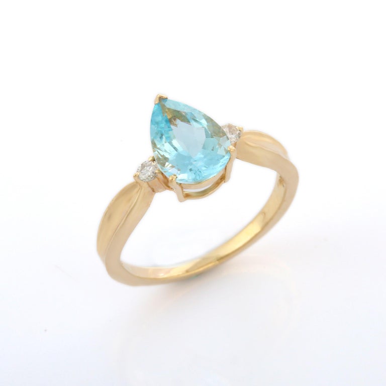 For Sale:  Pear Cut Aquamarine and Diamond Three Stone Engagement Ring in 14K Yellow Gold  7