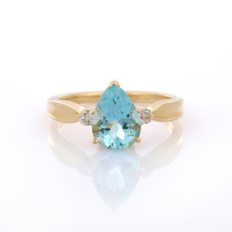 For Sale:  Pear Cut Aquamarine and Diamond Three Stone Engagement Ring in 14K Yellow Gold  9