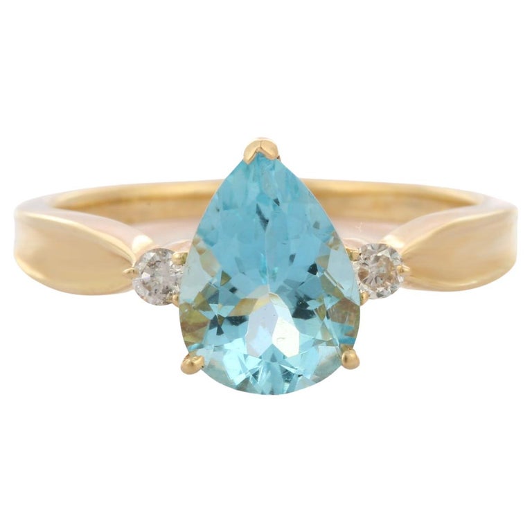 For Sale:  Pear Cut Aquamarine and Diamond Three Stone Engagement Ring in 14K Yellow Gold