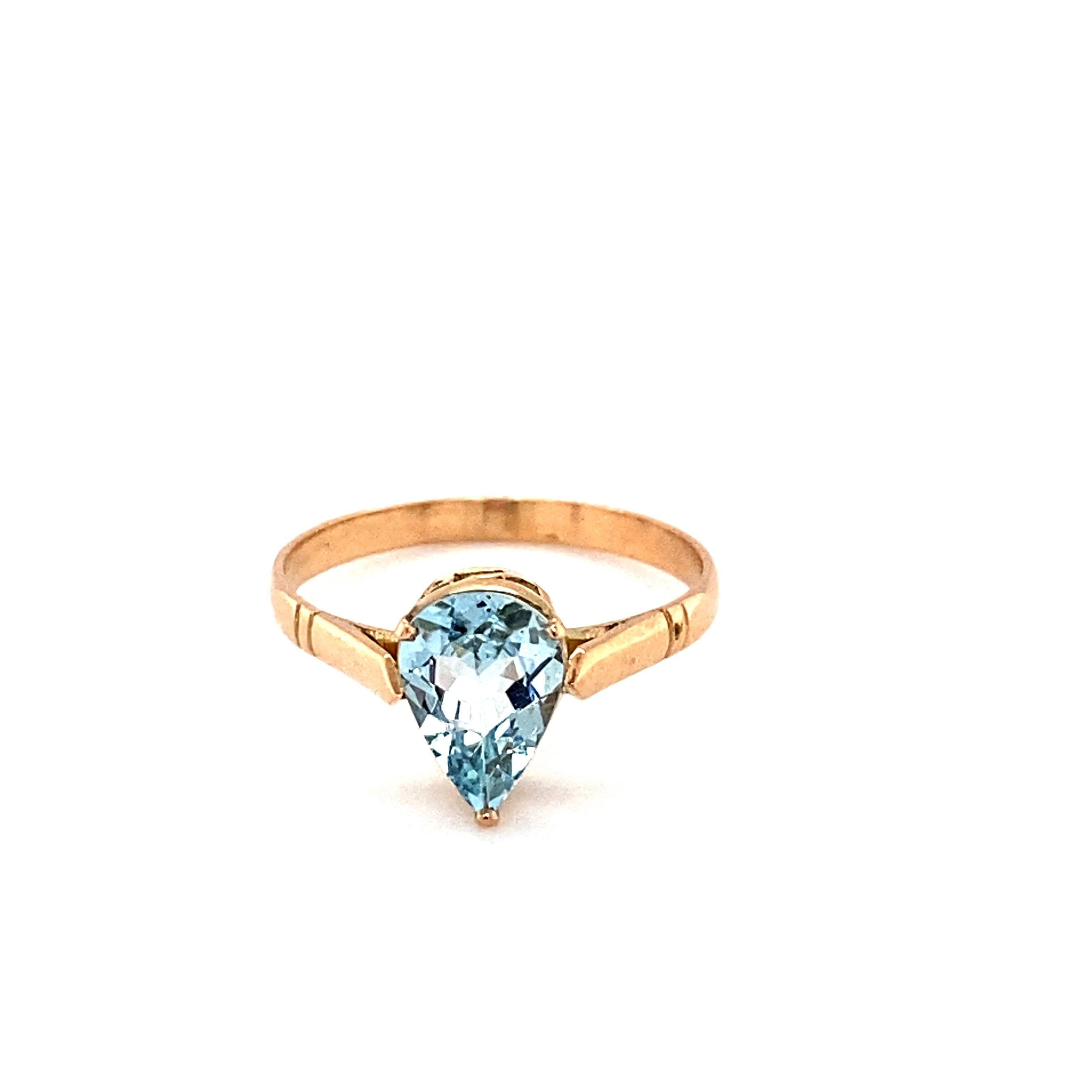 Pear cut aquamarine is mounted in 14K yellow gold. Beautifully hand crafted ring with three prongs is suitable for your everyday companion. Carefully chosen aquamarine is hand cut and polished. One of a kind ring to suit your style. Its sleek and