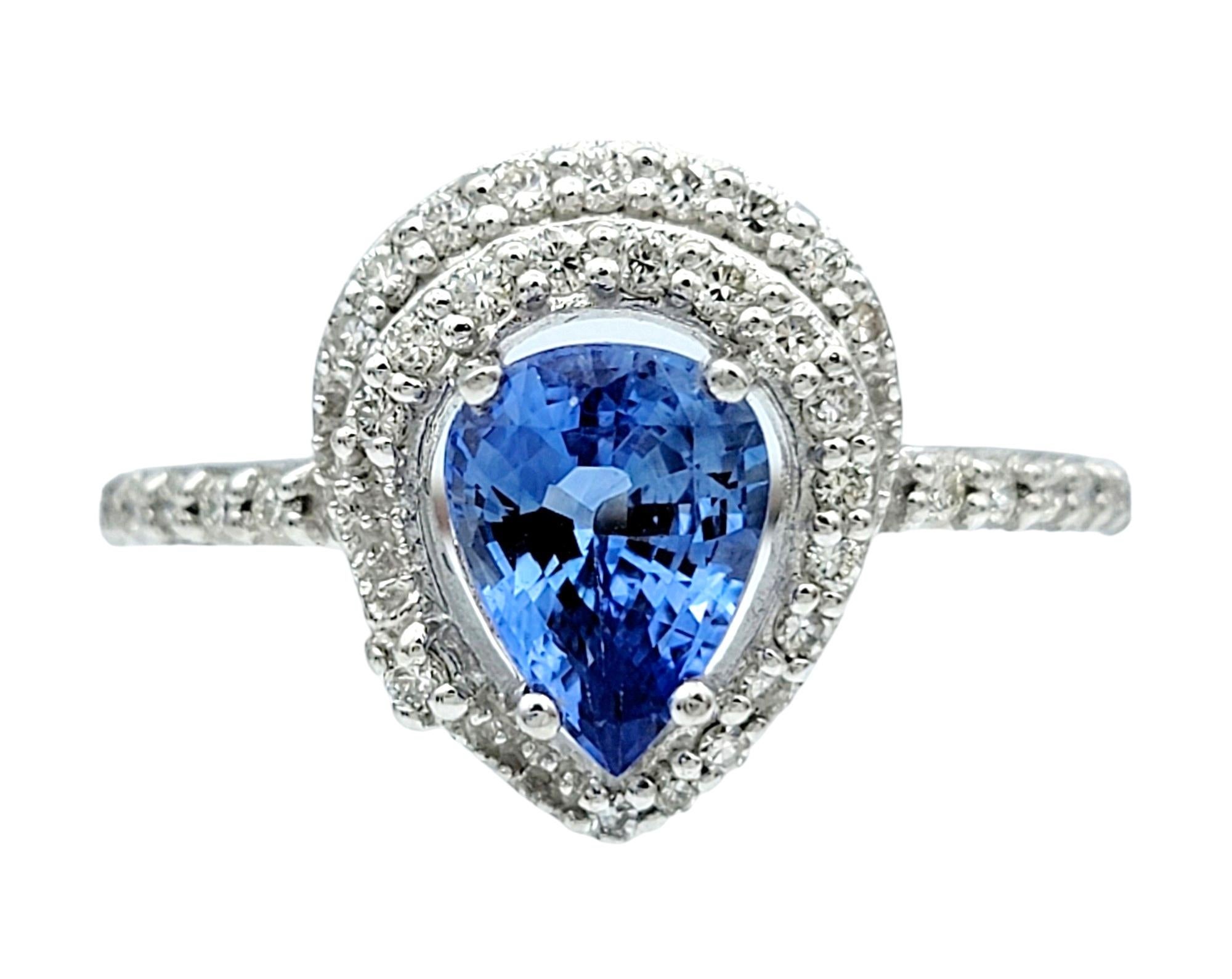 Contemporary Pear Cut Blue Ceylon Sapphire and Diamond Halo Ring Set in 18 Karat White Gold For Sale
