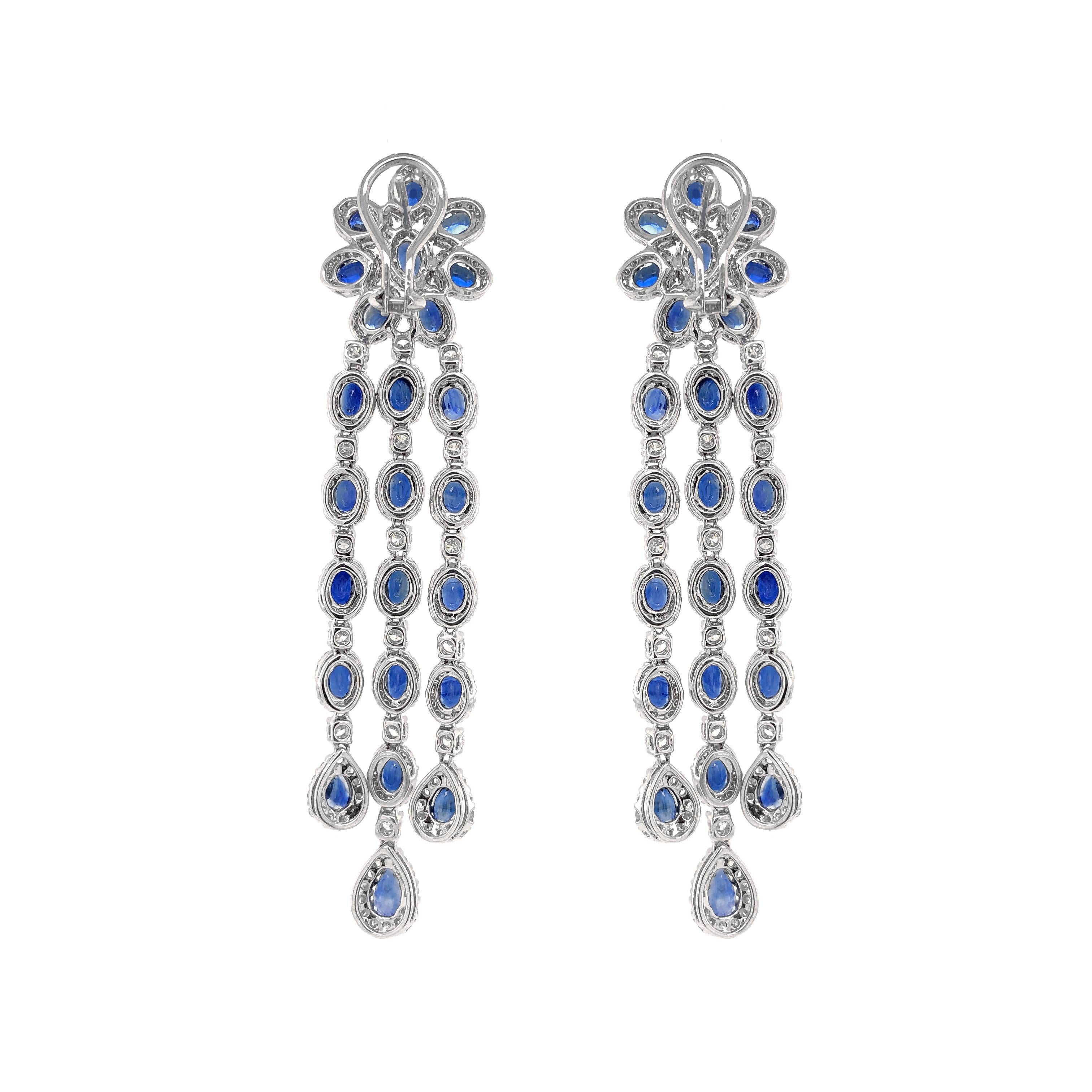 Handcrafted 18 karat gold chandelier earrings.
Ceylon pear cut blue sapphires 20.55 ct.
Accented with small round white diamonds 5.48 ct.
Diamonds are all natural in G-H Color Clarity VS. 
French / Omega clips.
Width: 1.7 cm
Height: 8.5 cm
Weight: