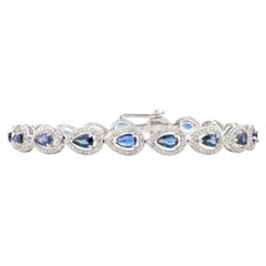 Bracciale tennis con diamante aureolato con zaffiro blu taglio pera in oro bianco 14 carati