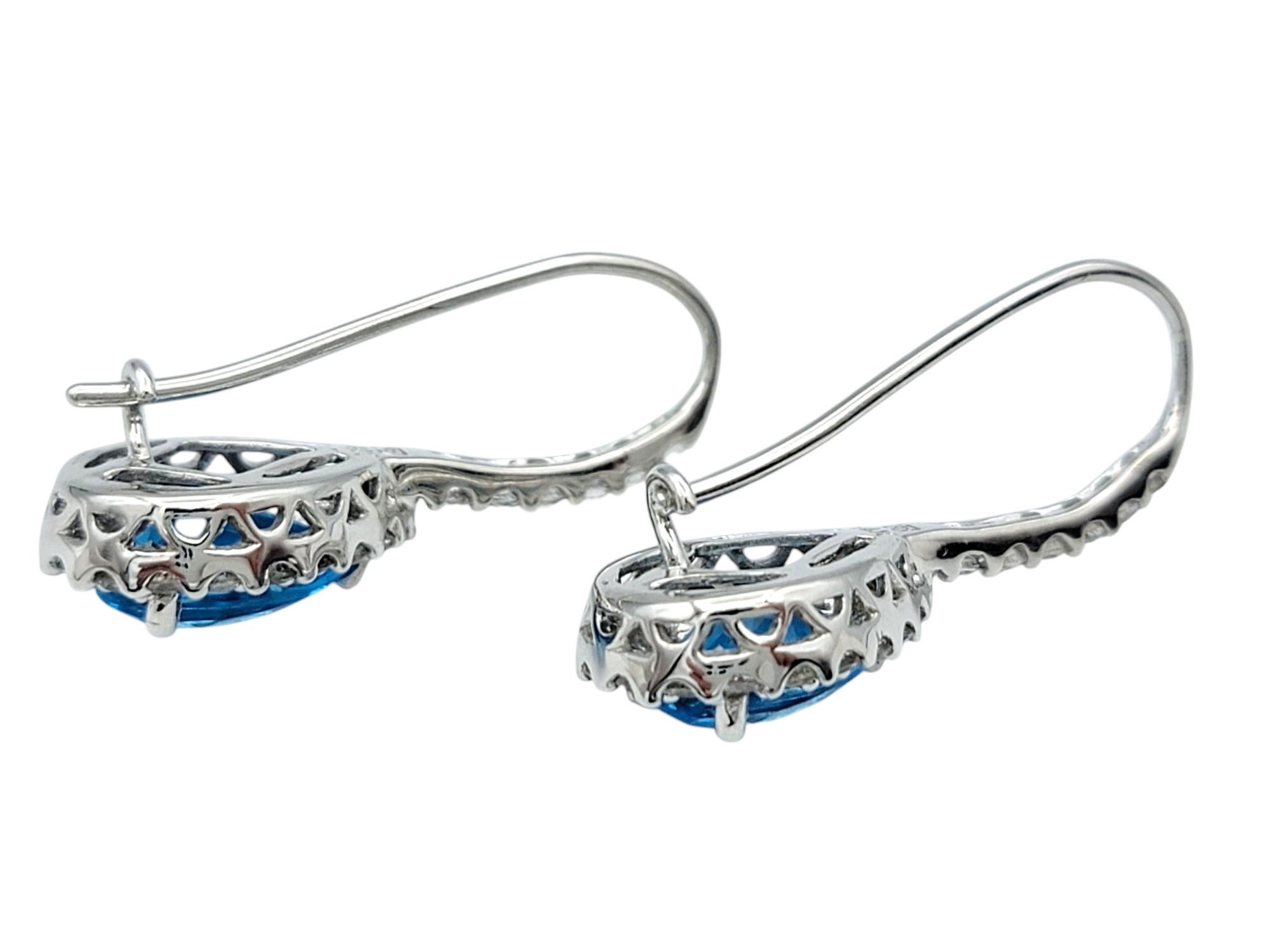 Pear Cut Blue Topaz and White Sapphire Halo Drop Earrings in 14 Karat White Gold In Good Condition For Sale In Scottsdale, AZ