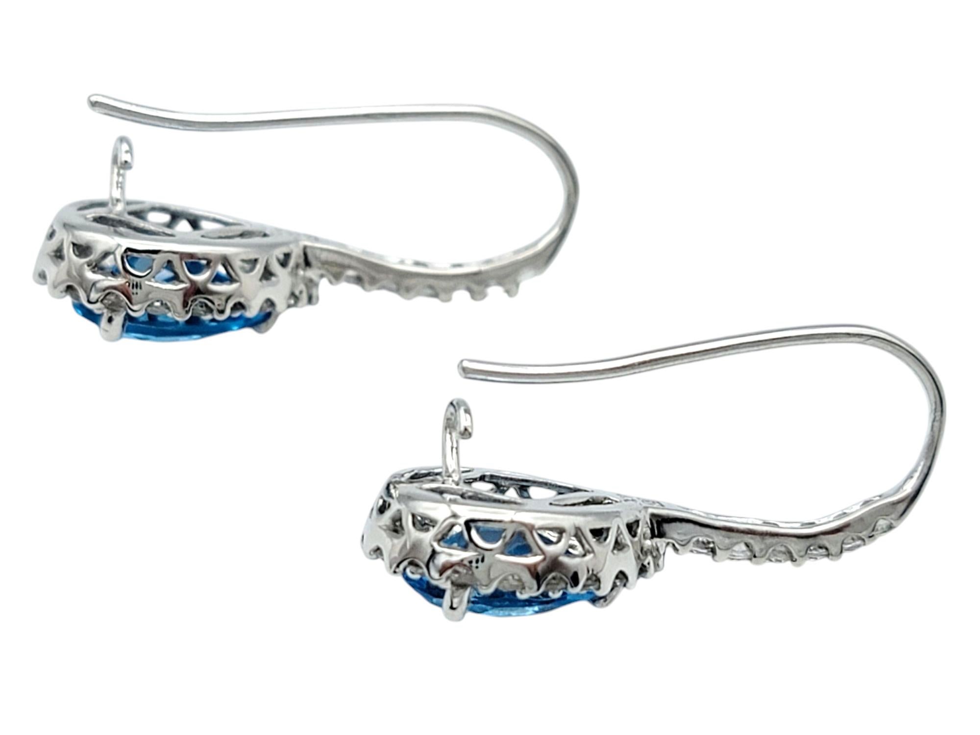 Women's Pear Cut Blue Topaz and White Sapphire Halo Drop Earrings in 14 Karat White Gold For Sale