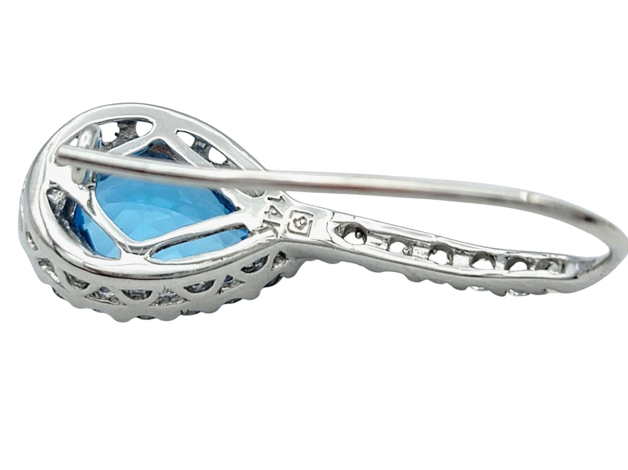 Pear Cut Blue Topaz and White Sapphire Halo Drop Earrings in 14 Karat White Gold For Sale 1