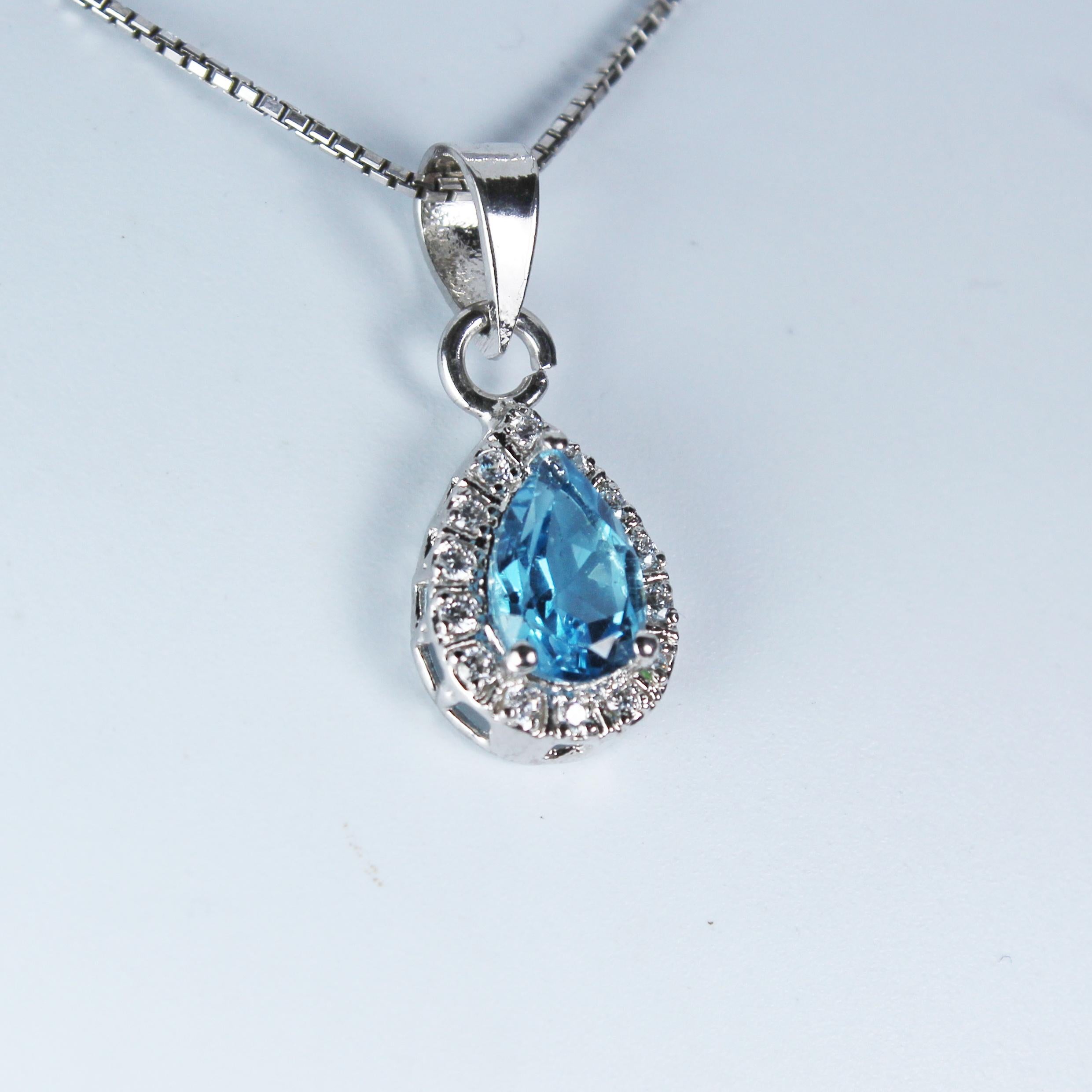 Product Details:

Metal of pendant - Sterling Silver
Diamonds - synthetic
Pendant size (without bail) - 13 x 9 mm
Pendant gross Weight - 1.68 Grams
Gemstone - Blue Topaz
Stone weight - 0.50 Carat
Stone shape - Pear
Stone size - 9 x 5 mm

Timeless