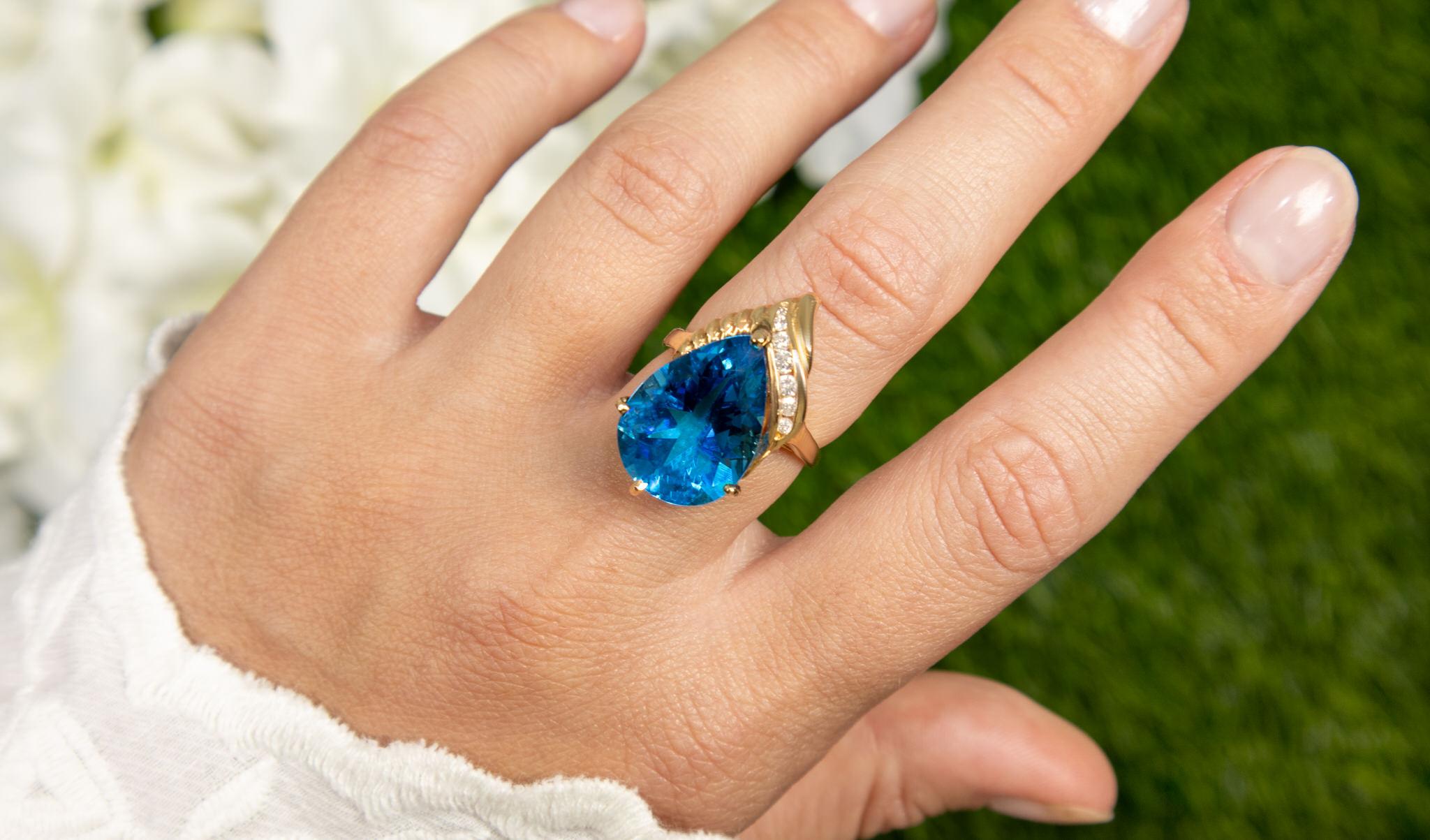 Contemporary Pear Cut Blue Topaz Ring Diamond Setting 9 Carats 14K Yellow Gold For Sale
