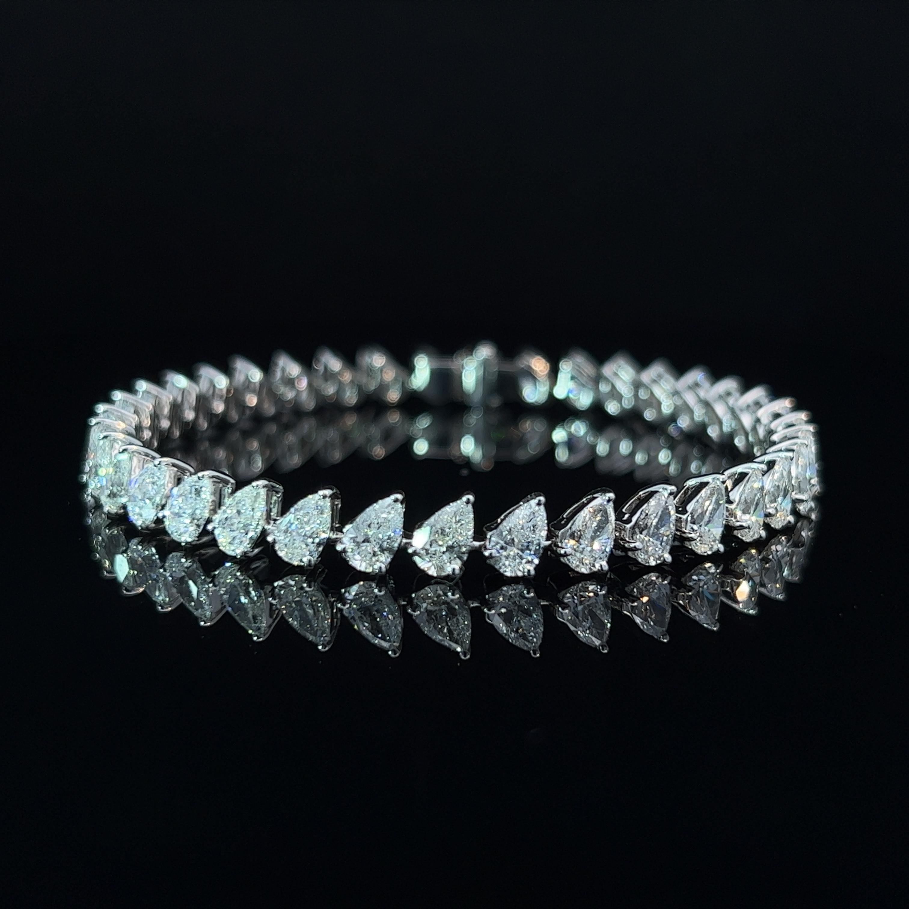 Diamond Shape: Pear Cut  
Total Diamond Weight: 11.36ct
Individual Diamond Weight: .33ct  
Color/Clarity: GH SI  
Metal: 18K White Gold 
Metal Weight: 14.78g

Key Features:

Pear-Cut Diamonds: The centerpiece of this bracelet features a dazzling