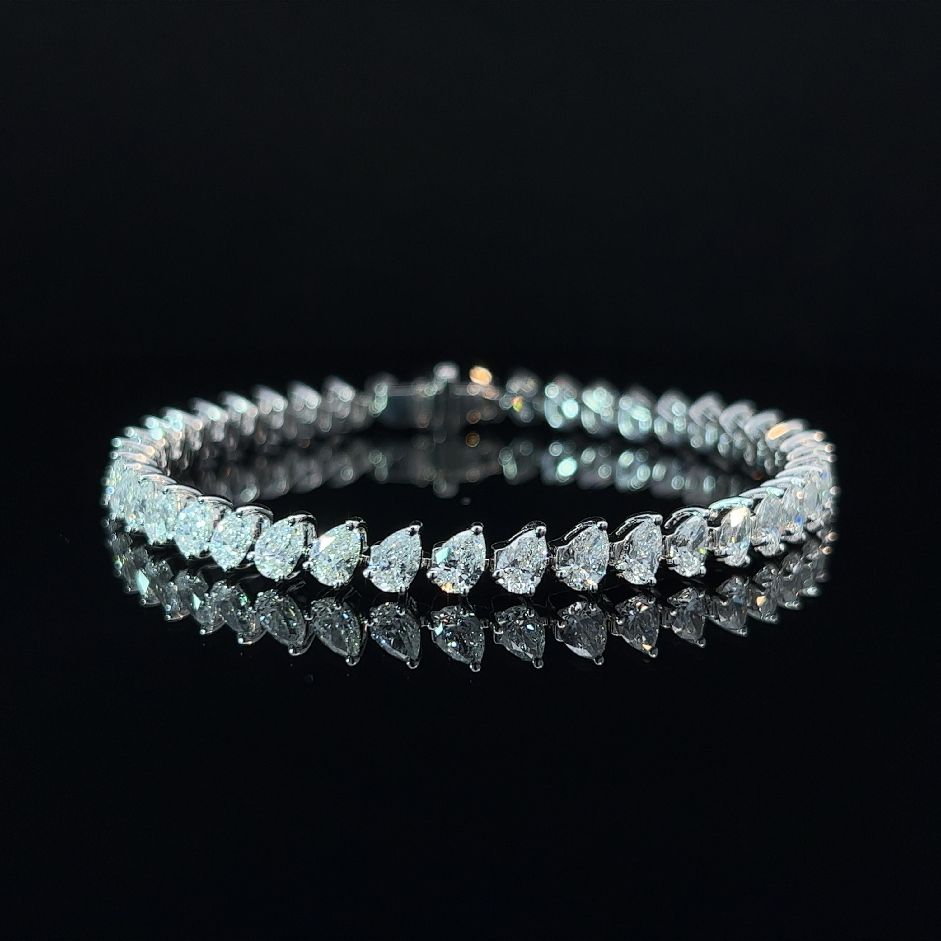 Diamond Shape: Pear Cut 
Total Diamond Weight: 9.94ct
Individual Diamond Weight: .25ct
Color/Clarity: GH SI  
Metal: 18K White Gold  
Metal Weight: 15.02g 

Key Features:

Pear-Cut Diamonds: The centerpiece of this bracelet features a dazzling array