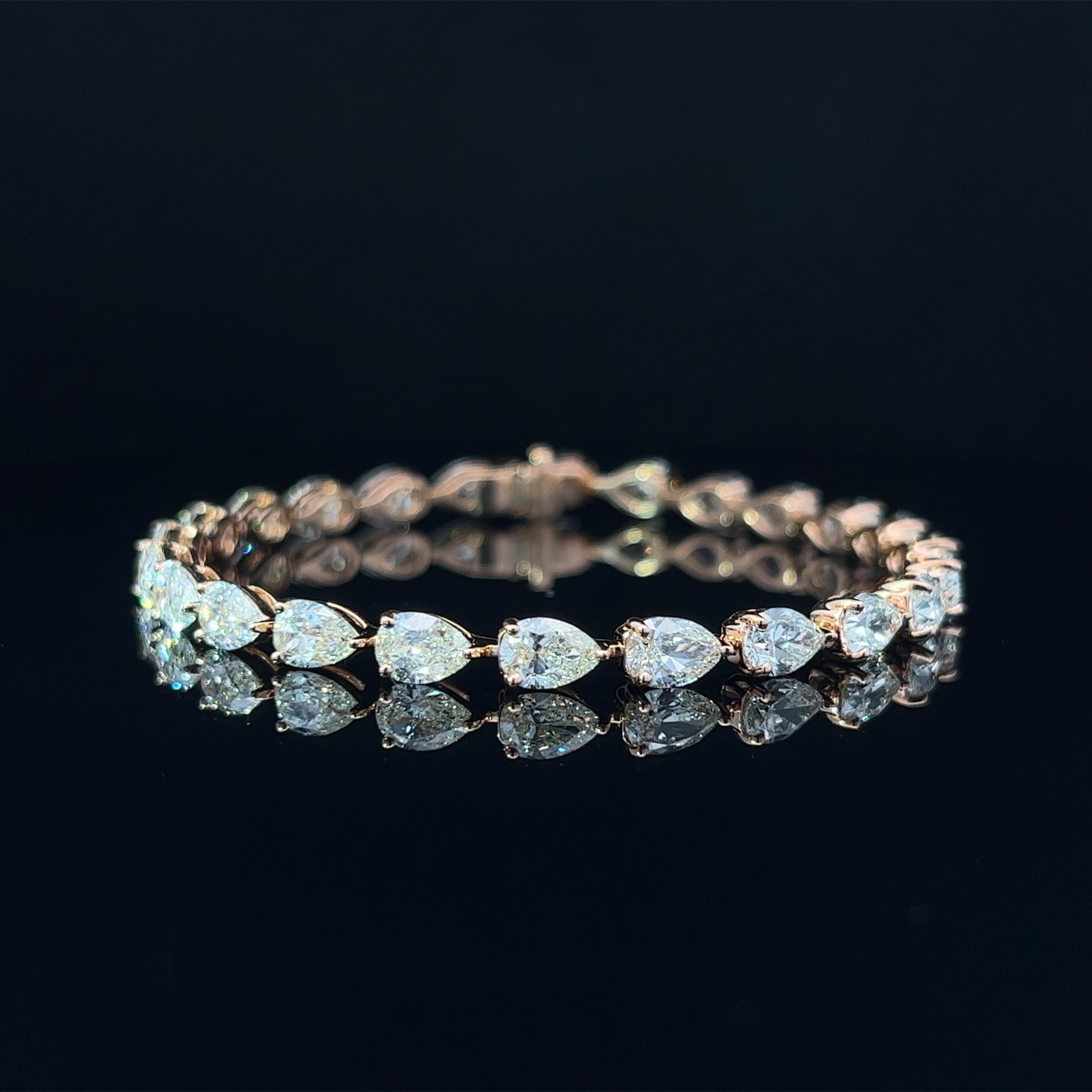Diamond Shape: Pear Cut 
Total Diamond Weight: 12.12ct
Individual Diamond Weight: .50ct
Color/Clarity: GH VS
Metal: 18K Rose Gold  
Metal Weight: 10.95g 

Key Features:

Pear-Cut Diamonds: The centerpiece of this bracelet features a dazzling array