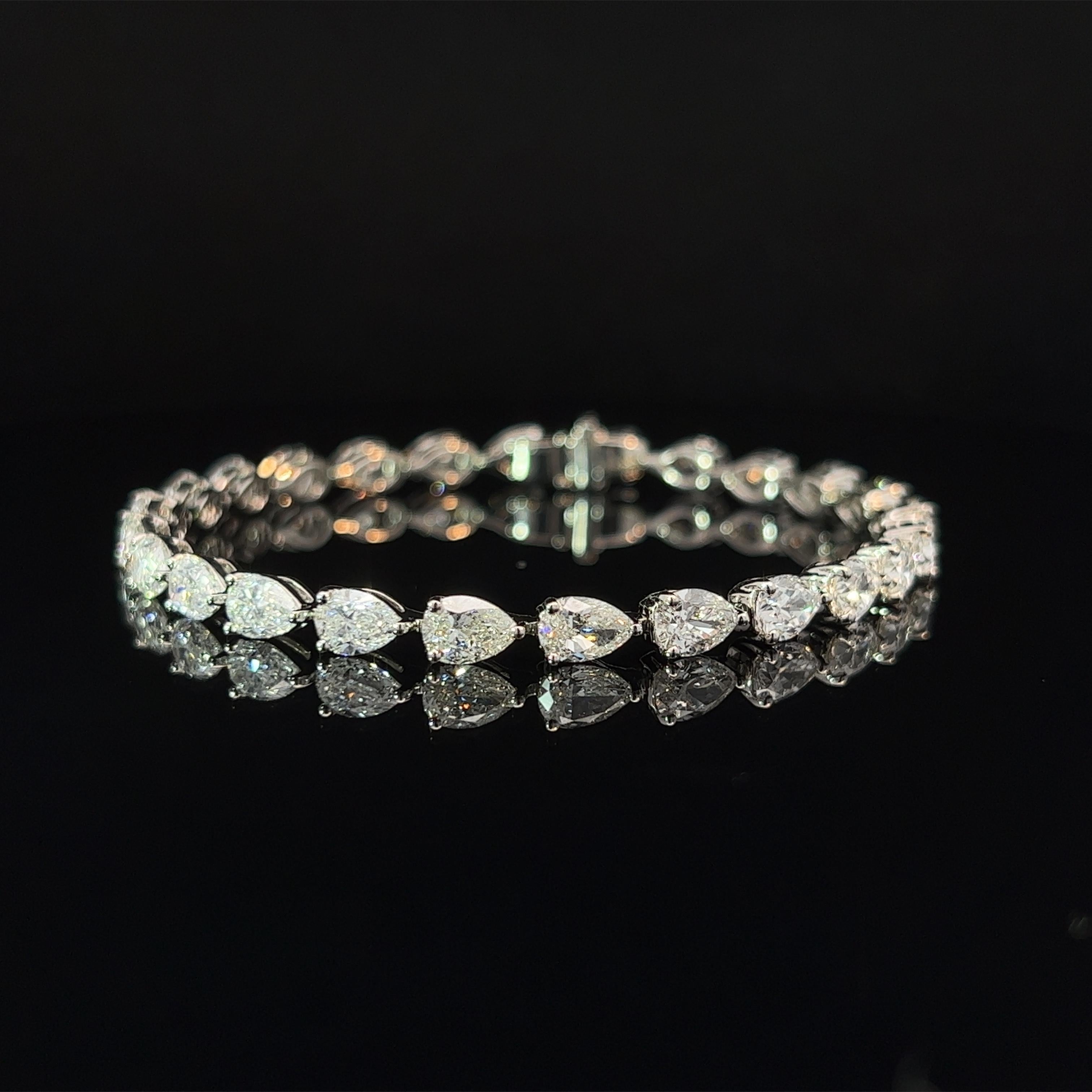 Diamond Shape: Pear Cut 
Total Diamond Weight: 12.61ct
Individual Diamond Weight: .50ct
Color/Clarity: FG VS  
Metal: Platinum 950
Metal Weight: 15.18g 

Key Features:

Pear-Cut Diamonds: The centerpiece of this bracelet features a dazzling array of