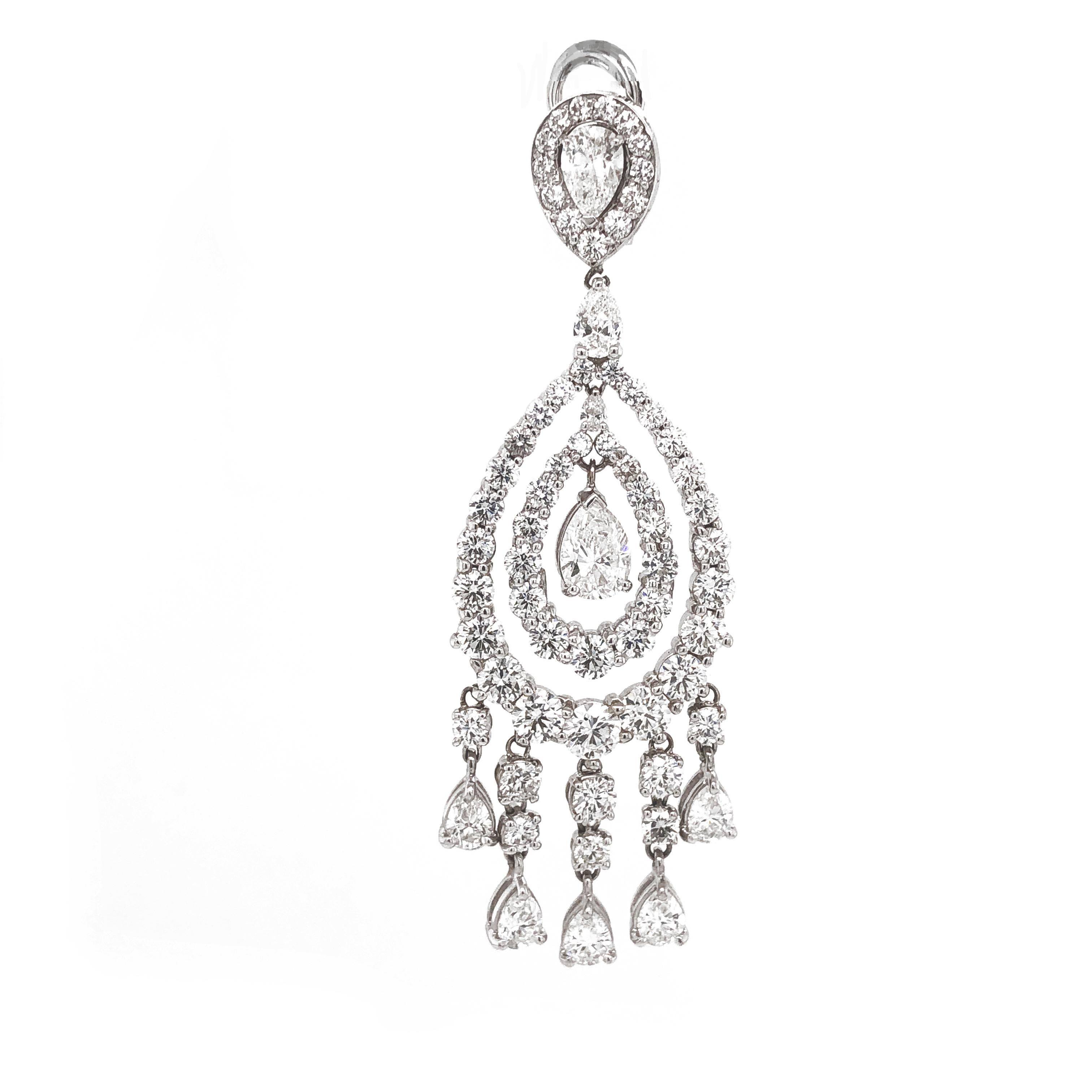 Handcrafted pear cut diamonds 2.03 ct chandelier 18 karat gold earrings.
Accented with small round diamonds 19.38 ct.
Diamonds are all natural and white in G-H Color Clarity VS. 
French / Omega clips.
Weight: 26.35 g