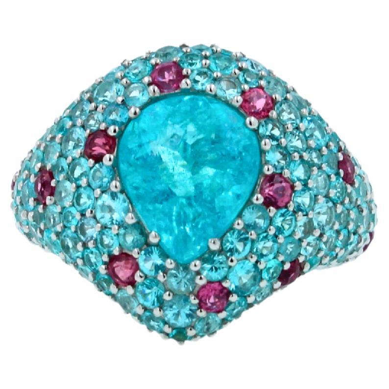 4.50 Carats Paraiba Tourmaline - Pear Cut Drop Shape Form
10.35 mm length of center gemstone
7.5 mm width of center gemstone
Paraiba Tourmalines Pave (Both Blue Neon Aqua & Reddish Pink Colors) - 3.50 ctw
18K White Gold
9.1 Grams
Ring Size 6
18.5 mm