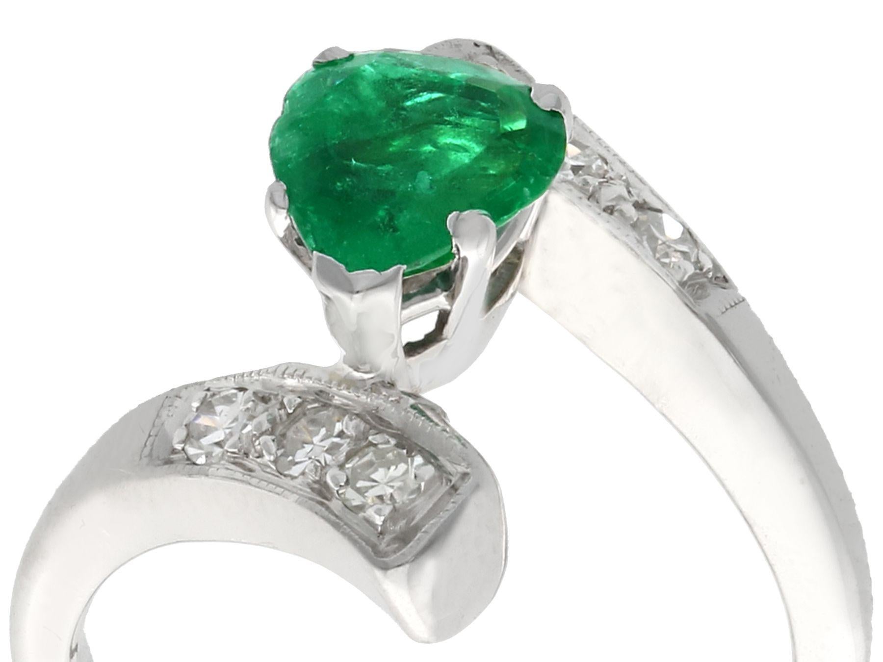An impressive vintage 1950's 0.89 carat emerald and 0.24 carat diamond platinum twist style dress ring; part of our diverse antique  estate jewelry collections.

This fine and impressive pear cut emerald and diamond ring has been crafted in