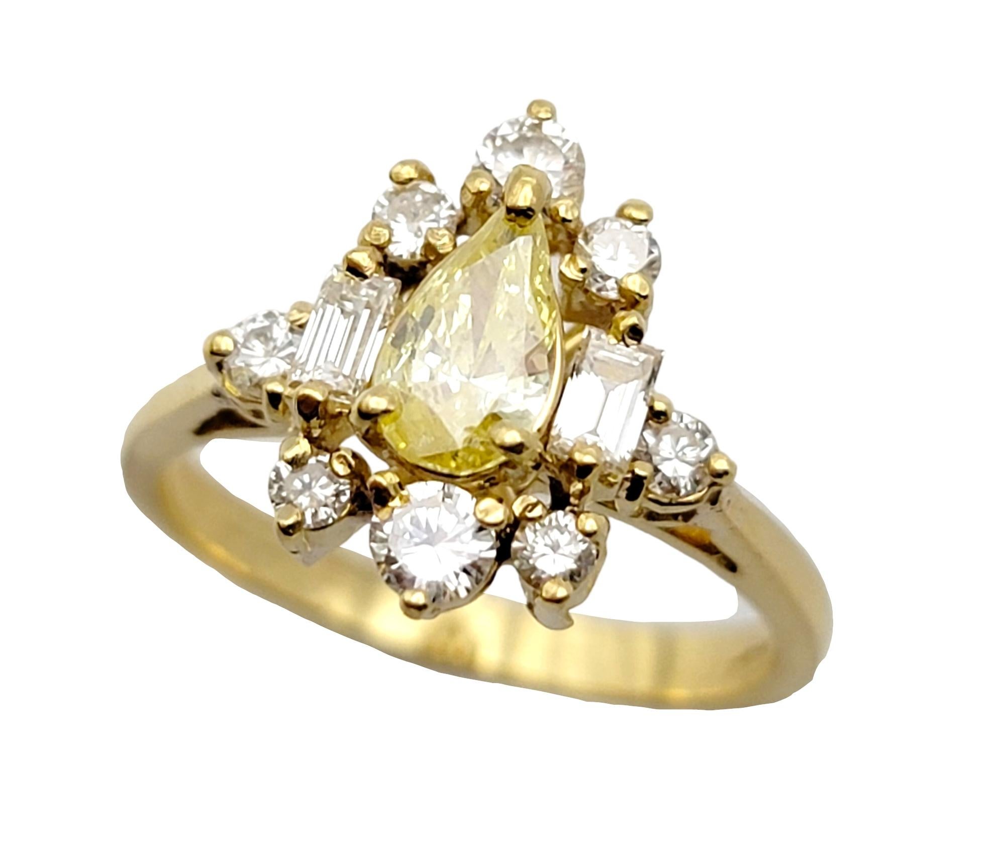 Ring size: 6.5

We absolutely love the gorgeously golden hues in this glittering yellow and white diamond ring. The fancy yellow pear shaped diamond flatters the finger while the surrounding clustered natural white diamonds pop elegantly against the