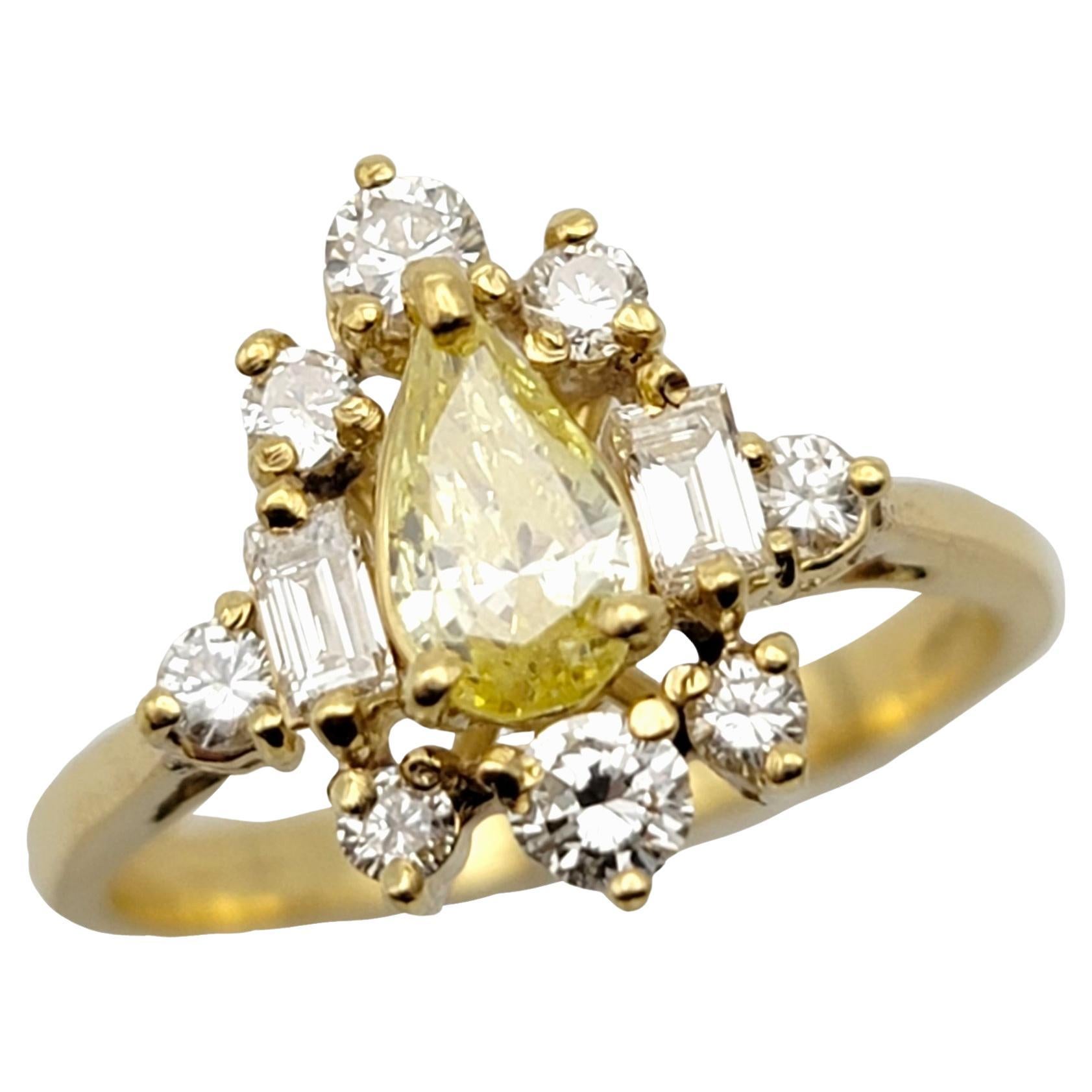 Pear Cut Fancy Yellow Diamond Ring with White Diamond Accents 18 Karat Gold Band