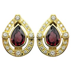 Pear Cut Garnet and Diamond Halo Teardrop Stud Earrings in 18 Karat Yellow Gold