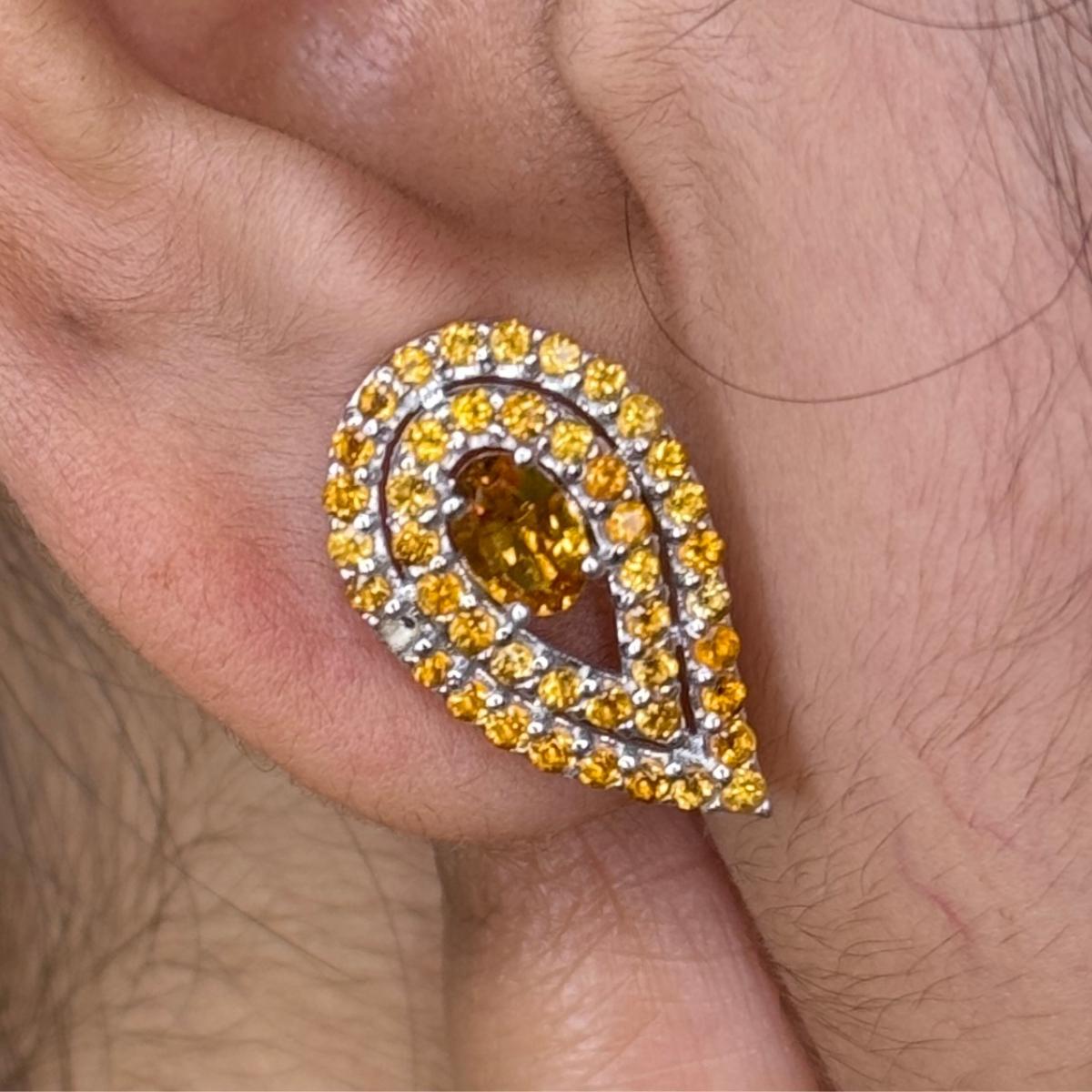 Handcrafted Pear Cut Citrine Stud Earrings in sterling silver to make a statement with your look. You shall need stud earrings to make a statement with your look. These earrings create a sparkling, luxurious look featuring,  oval, round cut natural
