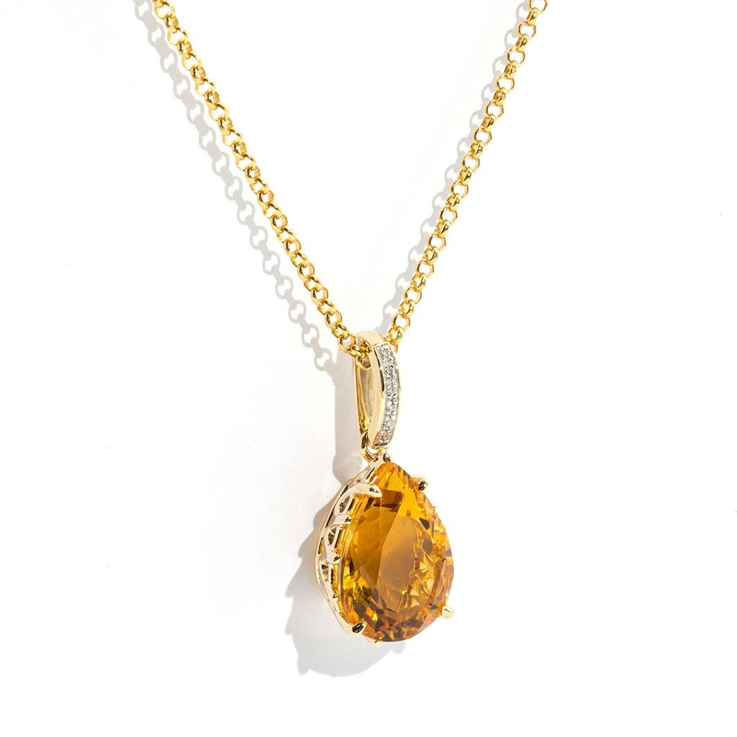 Forged in 9 carat yellow gold is this gorgeous vintage inspired pendant featuring a pear cut bright orange citrine, held in a charming basket style setting, and sways gently from a bail embellished with diamonds. We have named this vintage piece The