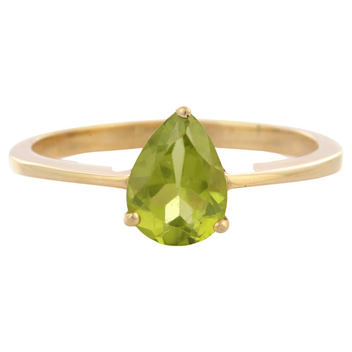 For Sale:  Pear Cut Peridot Solitaire Ring in 14K Yellow Gold