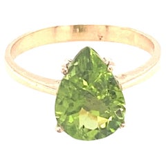 Peridot mit Birnenschliff Gelbgold Solitär Ring