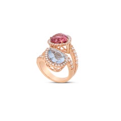 Pear-cut pink tourmaline and aquamarine white diamonds bypass cocktail ring