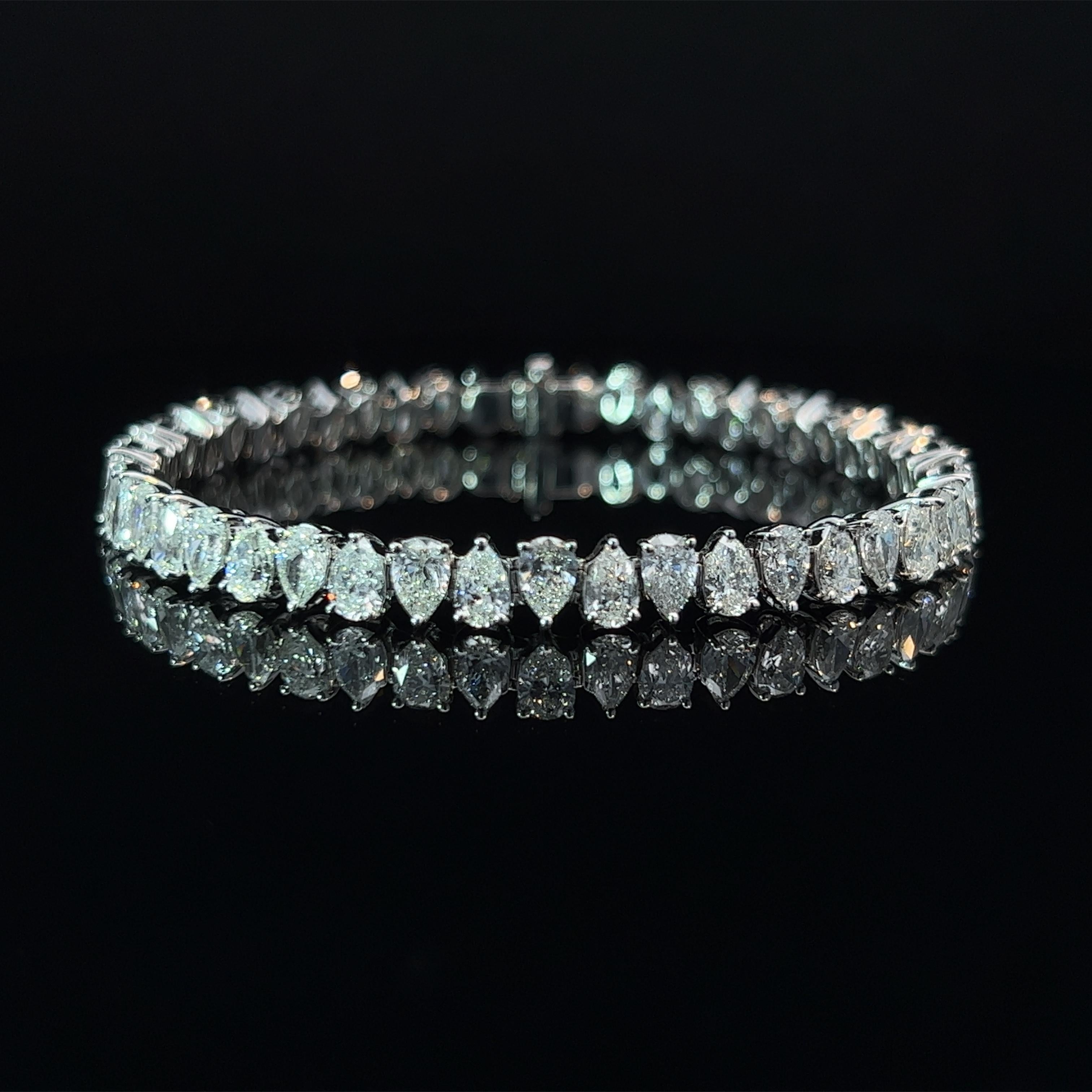 Diamond Shape: Pear Cut 
Total Diamond Weight: 11.65ct
Individual Diamond Weight: .25ct
Color/Clarity: GH SI  
Metal: 18K White Gold  
Metal Weight: 18.02g 

Key Features:

Pear-Cut Diamonds: The centerpiece of this bracelet boasts a dazzling array