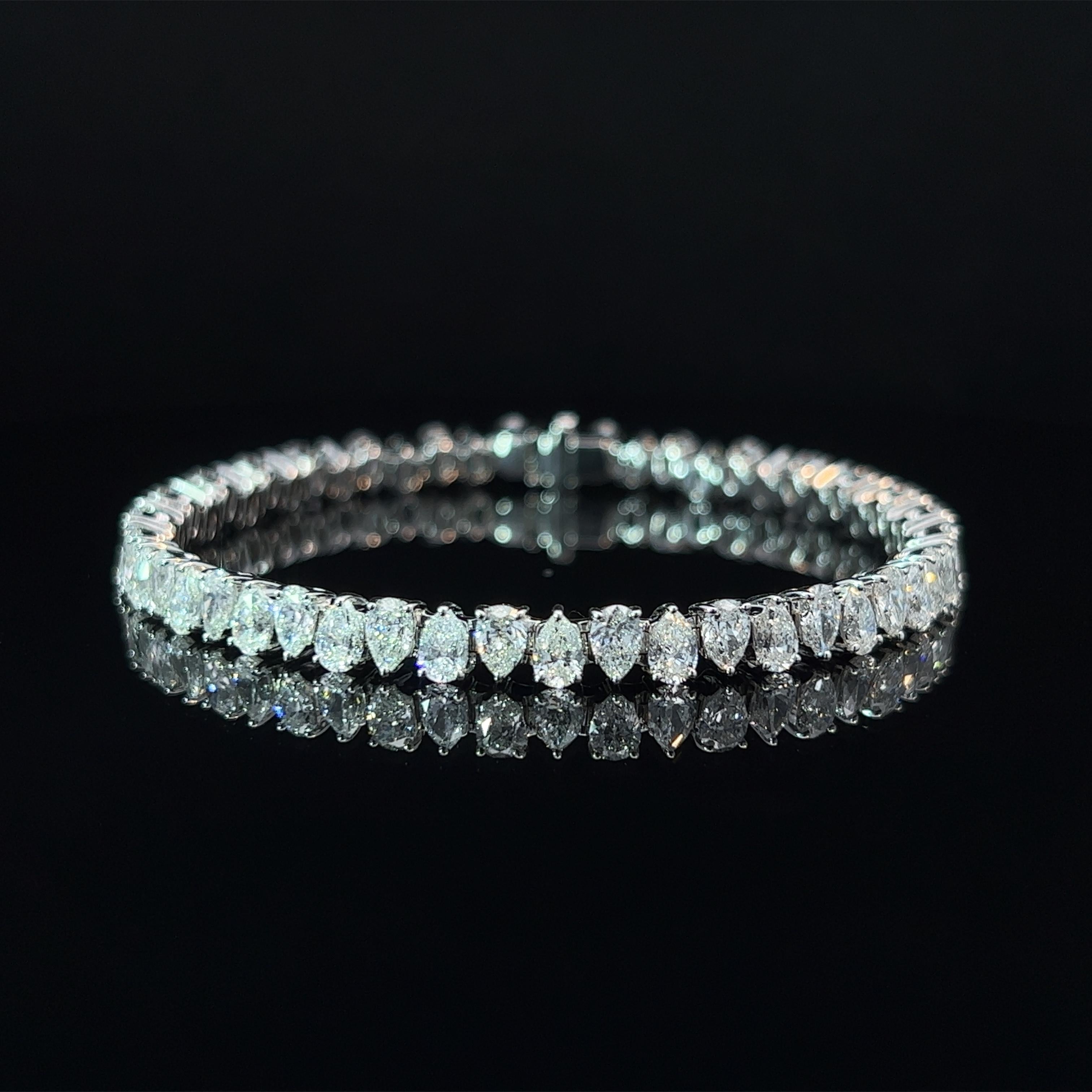 Diamond Shape: Pear Cut 
Total Diamond Weight: 10.18ct
Individual Diamond Weight: .20ct
Color/Clarity: FG VVS 
Metal: 18K White Gold  
Metal Weight: 18.19g 

Key Features:

Pear-Cut Diamonds: The centerpiece of this bracelet showcases a dazzling