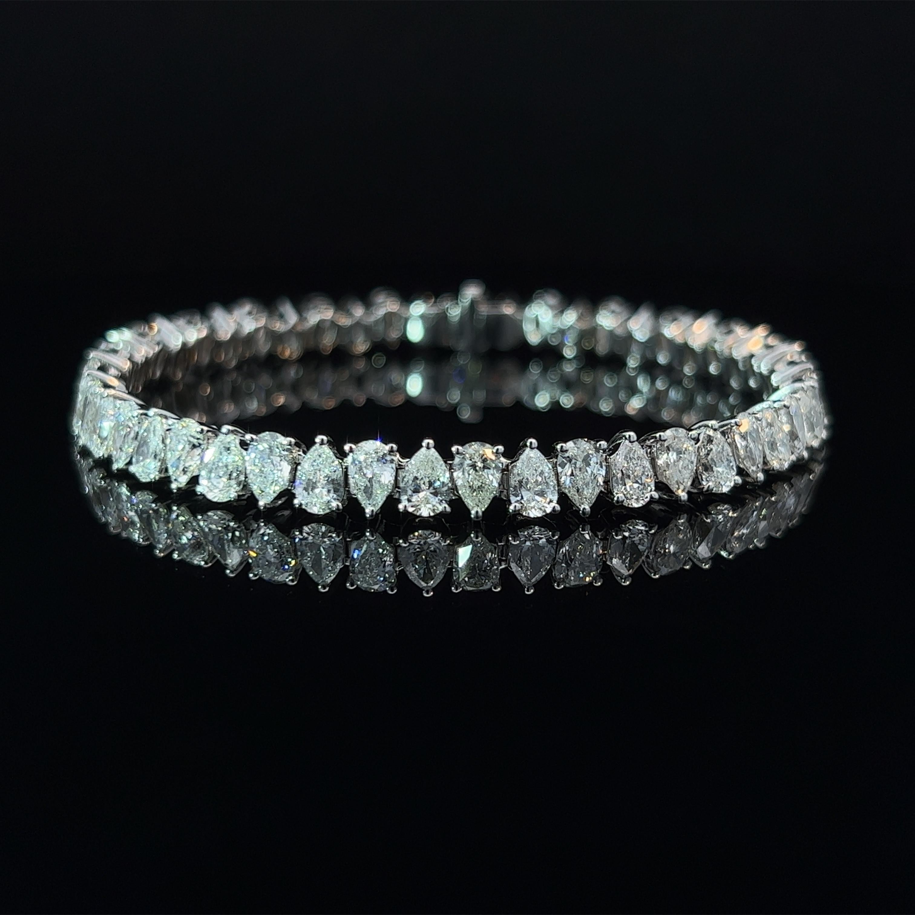 Diamond Shape: Pear Cut 
Total Diamond Weight: 11.89ct
Individual Diamond Weight: .25ct
Color/Clarity: GH VS  
Metal: 18K White Gold  
Metal Weight: 18.59g 

Key Features:

Pear-Cut Diamonds: The centerpiece of this bracelet features a dazzling