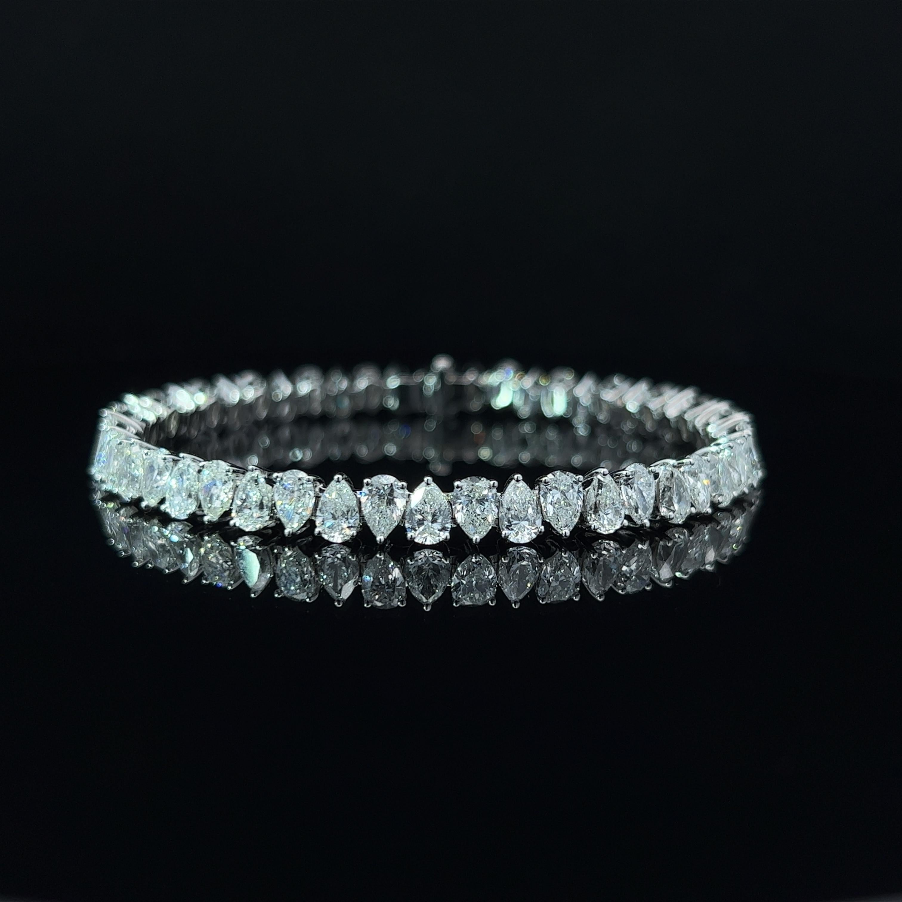 Diamond Shape: Pear Cut 
Total Diamond Weight: 15.21ct
Individual Diamond Weight: .33ct
Color/Clarity: GH VS  
Metal: 18K White Gold  
Metal Weight: 18.46g 

Key Features:

Pear-Cut Diamonds: The centerpiece of this bracelet features a dazzling