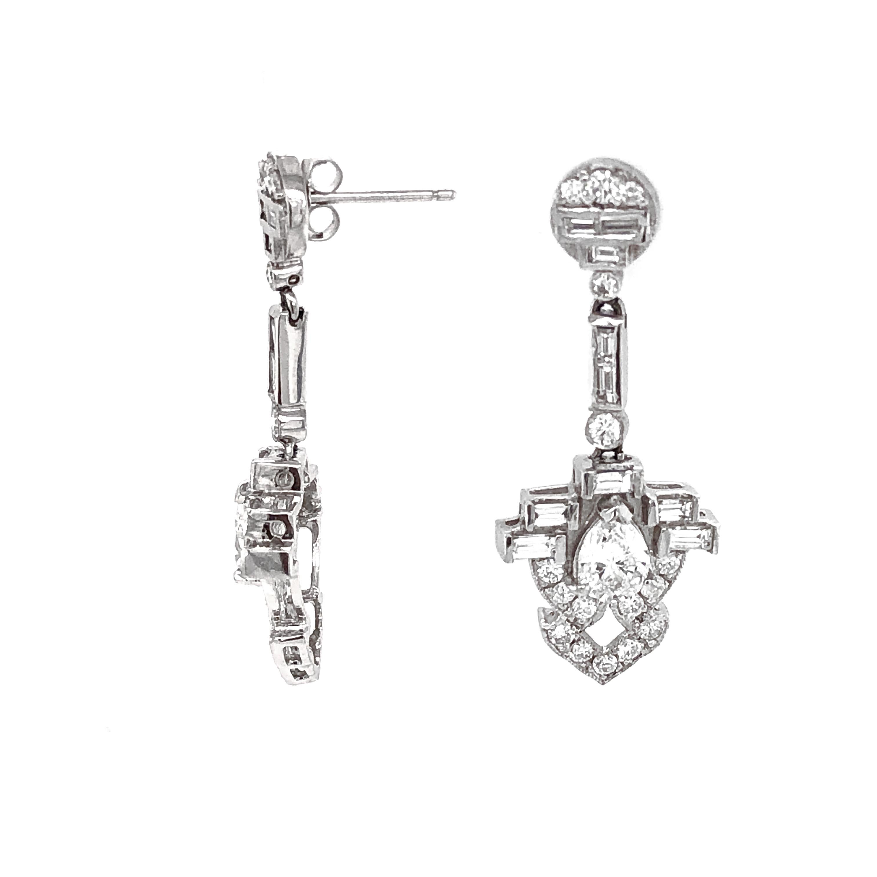 Simple drop diamond platinum earring with center diamond stone in pear cut and accented with smaller round diamonds. 
All diamonds in total are 3.39 carat. 
Diamonds are white and natural and in G-H Color Clarity VS.
Platinum 950.
Butterfly