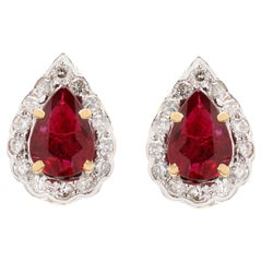Pear Cut Ruby Amidst Halo Diamond Studs Handcrafted in Solid 18k Yellow Gold