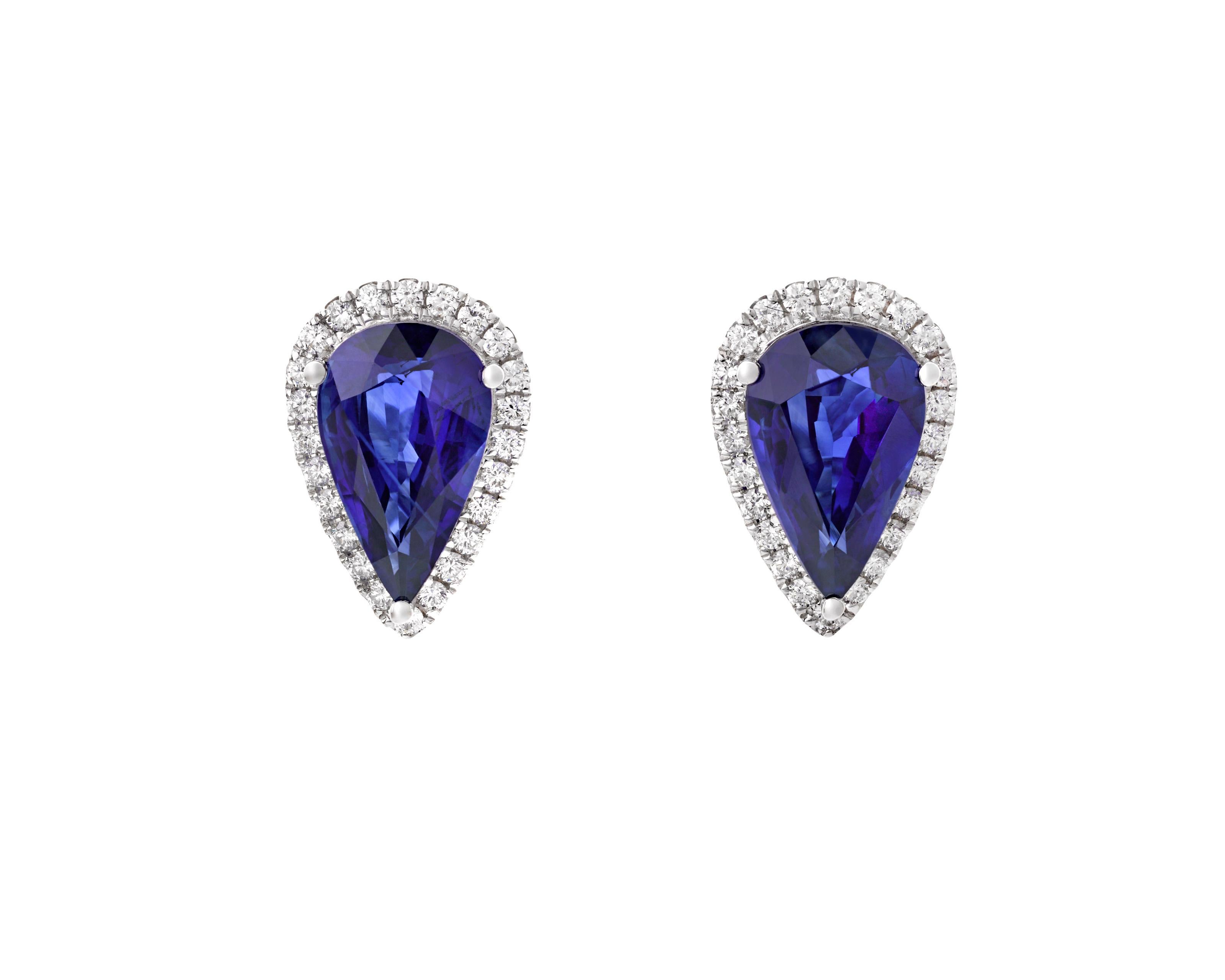 Two stunning sapphires weighing a combined 6.15 carats are set in these earrings. The pear-shaped gemstones are encircled by white diamonds totaling 0.47 carat in an 18K white gold setting. 