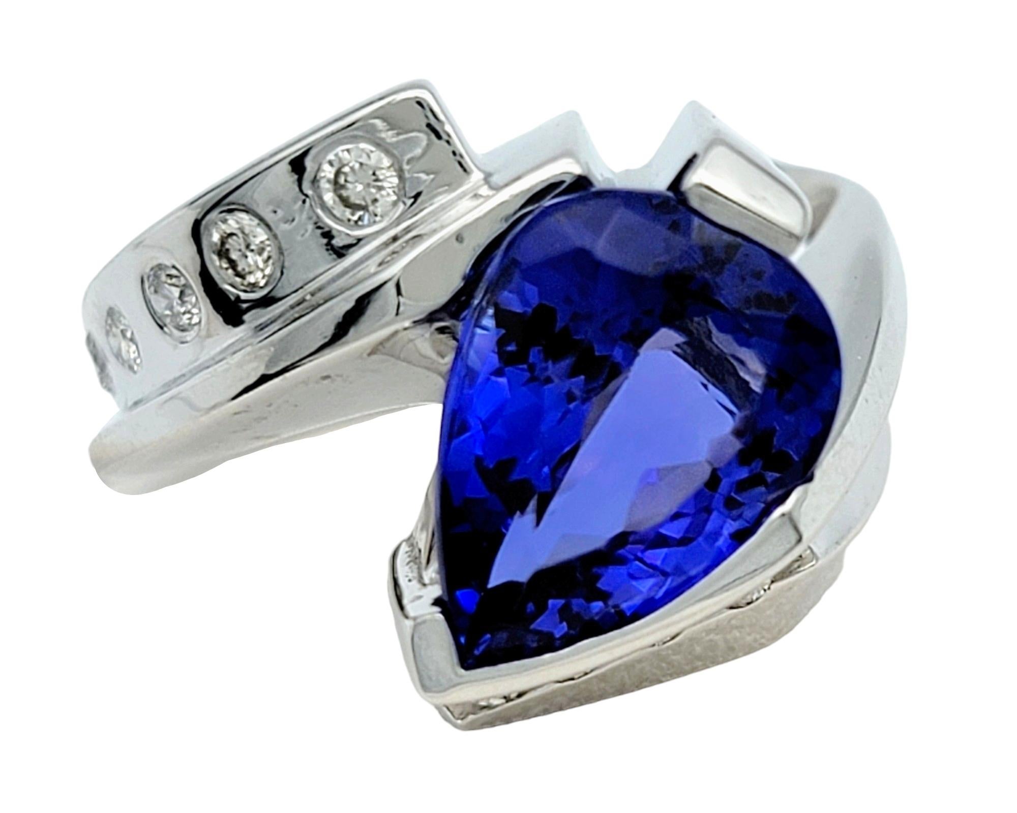 Contemporary Pear Cut Tanzanite and Diamond Bypass Style Ring Set in 14 Karat White Gold For Sale